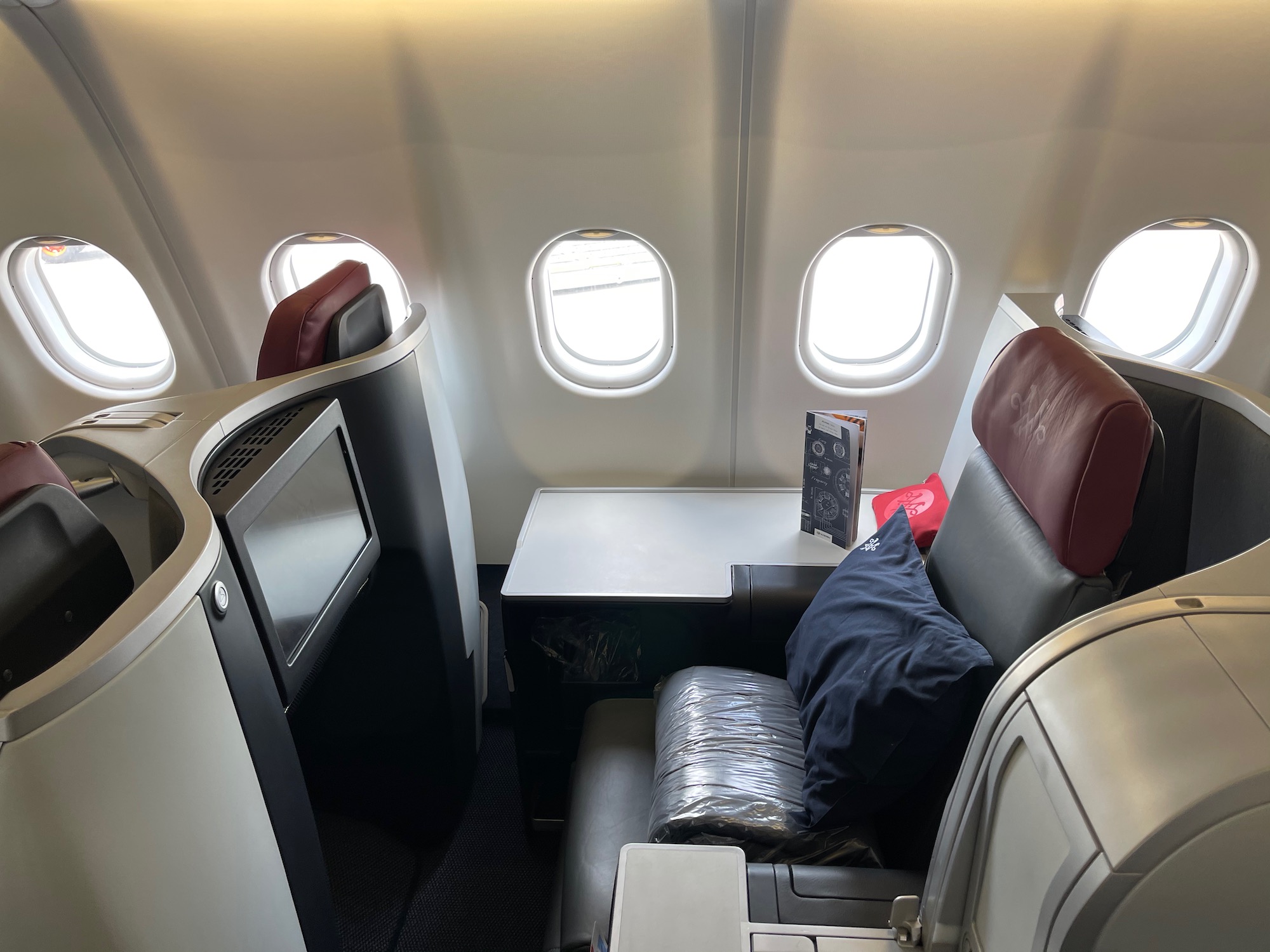 a seat and table in an airplane