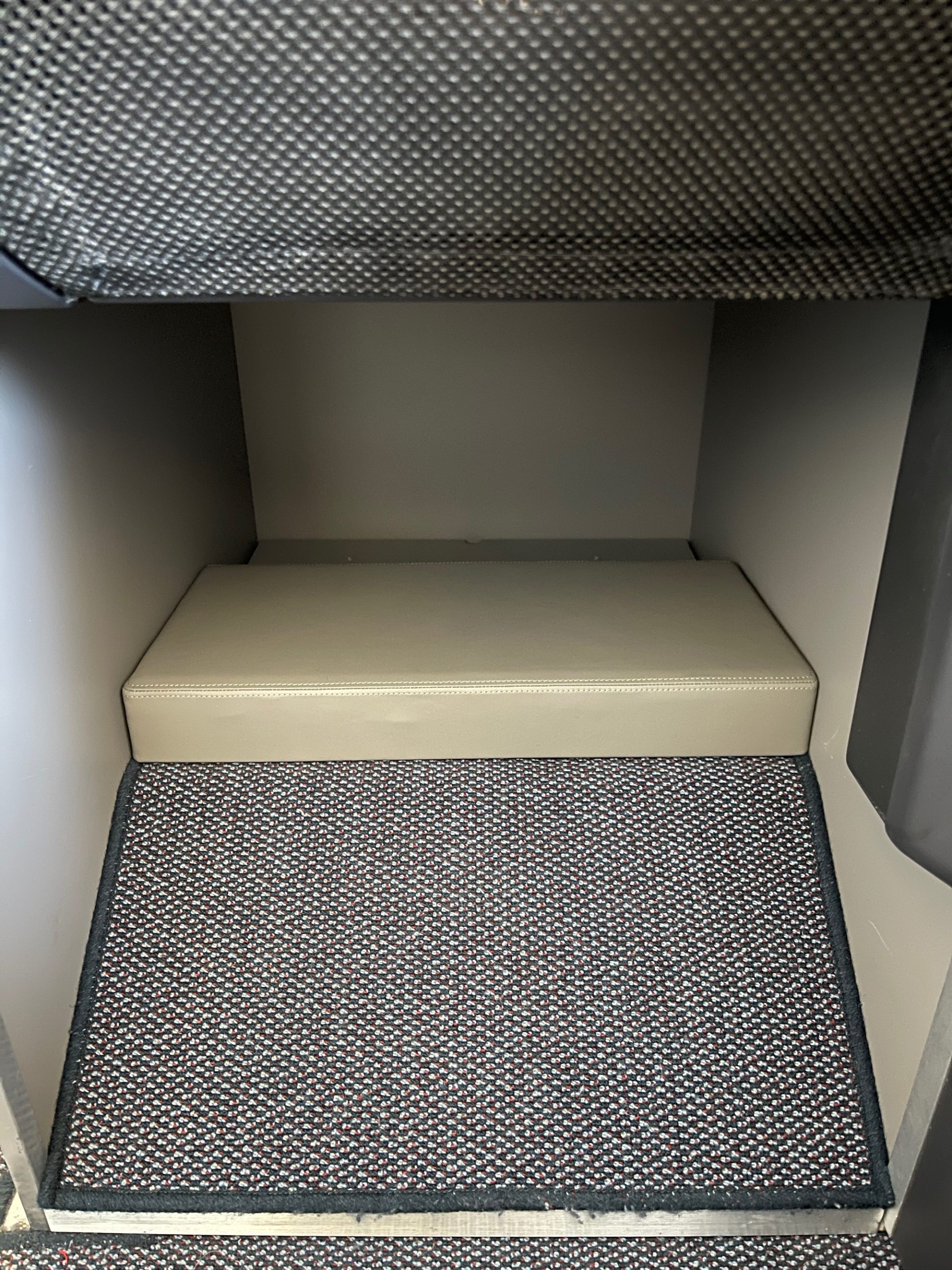a carpeted floor in a small room