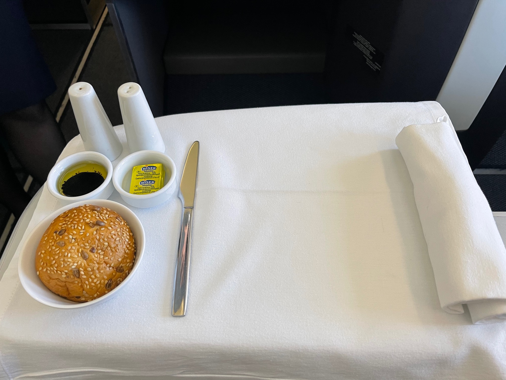 a plate of food and a knife on a table