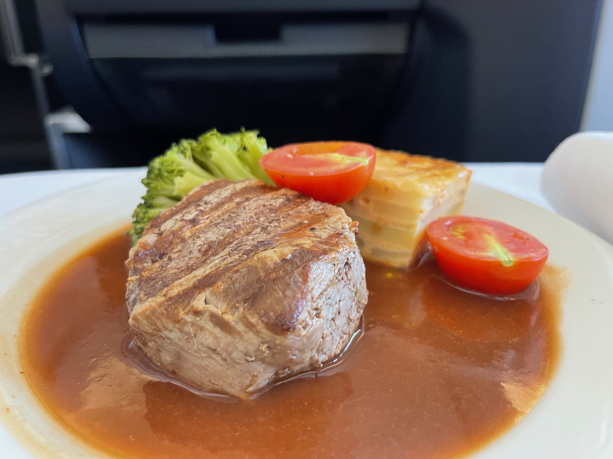 a plate of food with meat and vegetables