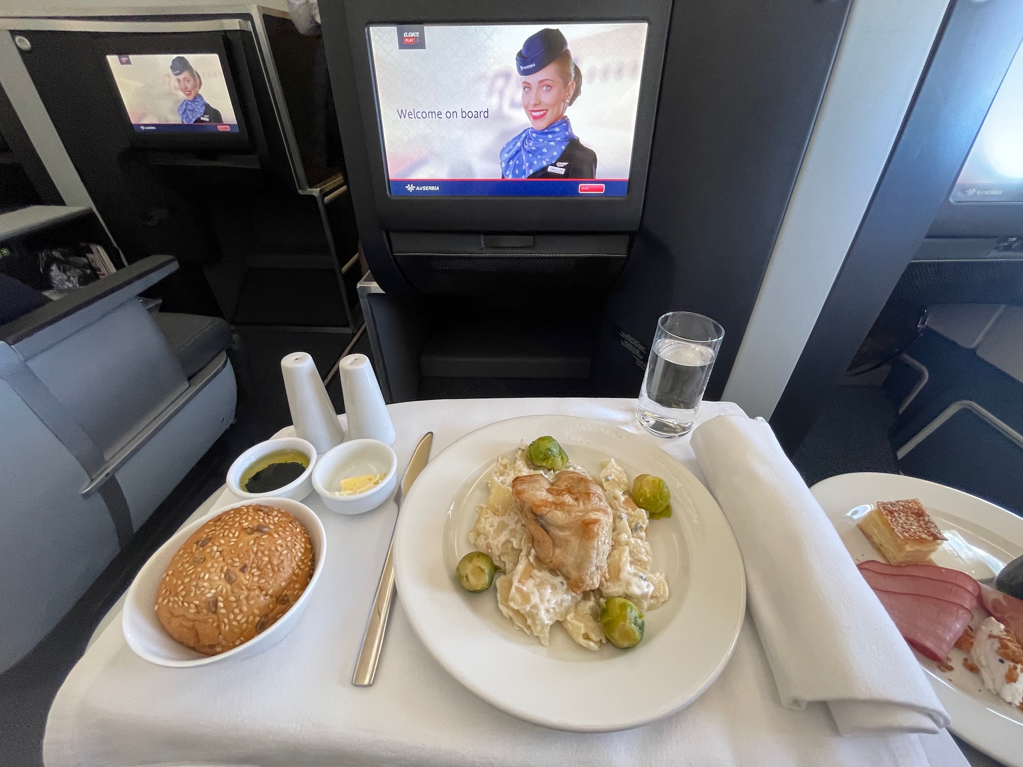 a plate of food on a table with a television