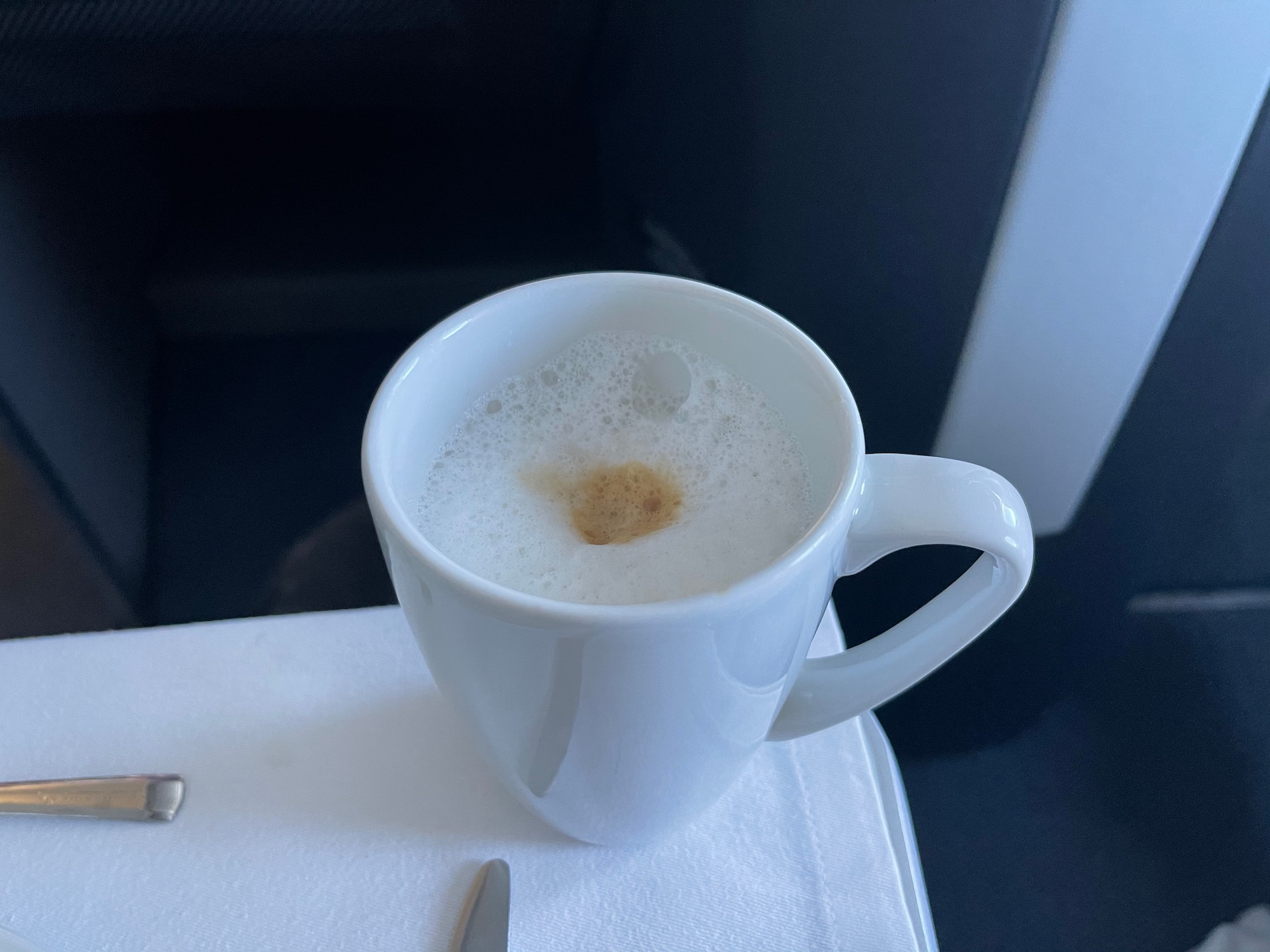 a cup of coffee with foam