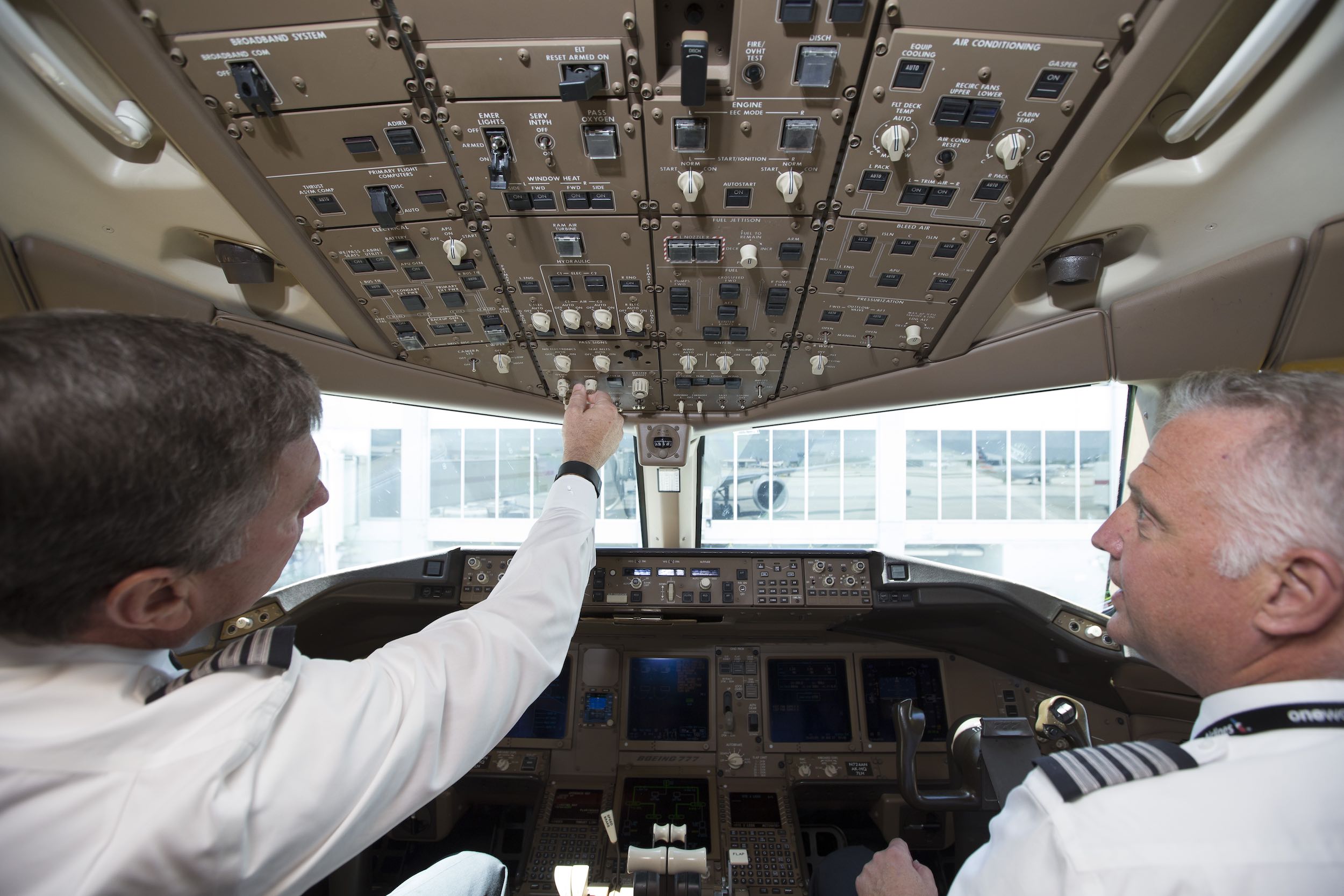 two men in the cockpit of an airplane