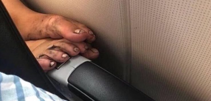 a person's feet on a seat