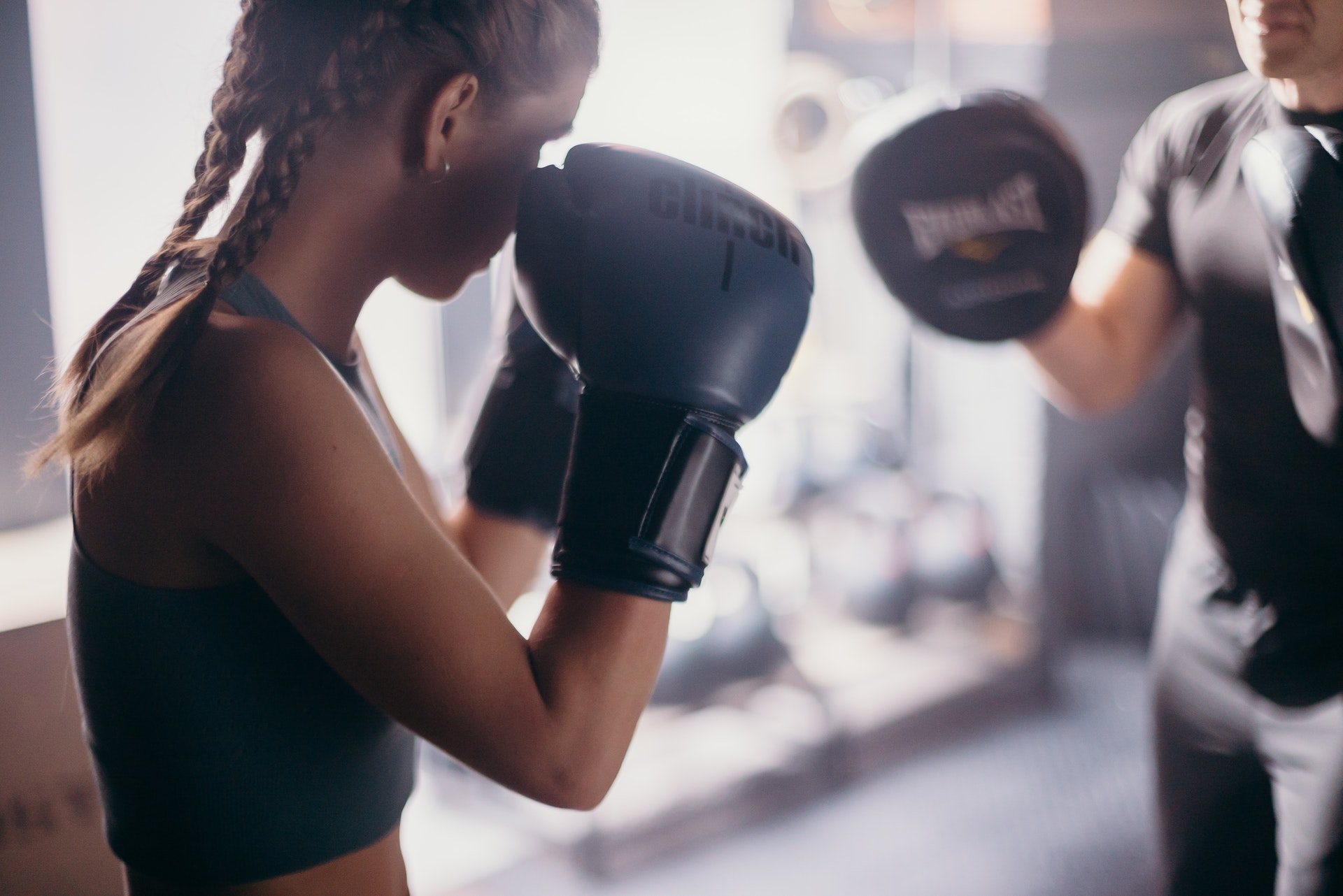 a woman wearing boxing gloves