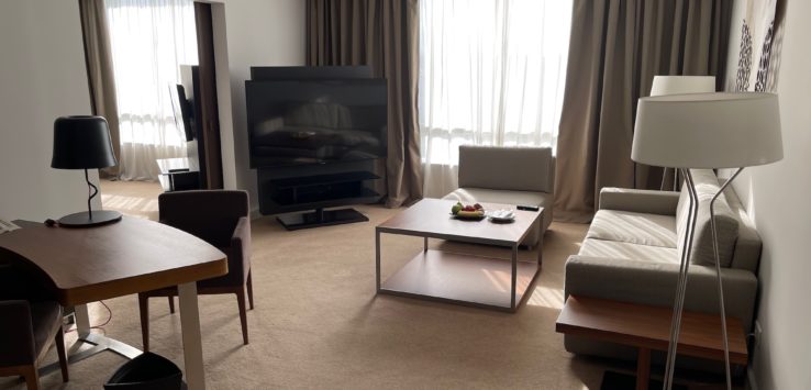 a living room with a tv and a table