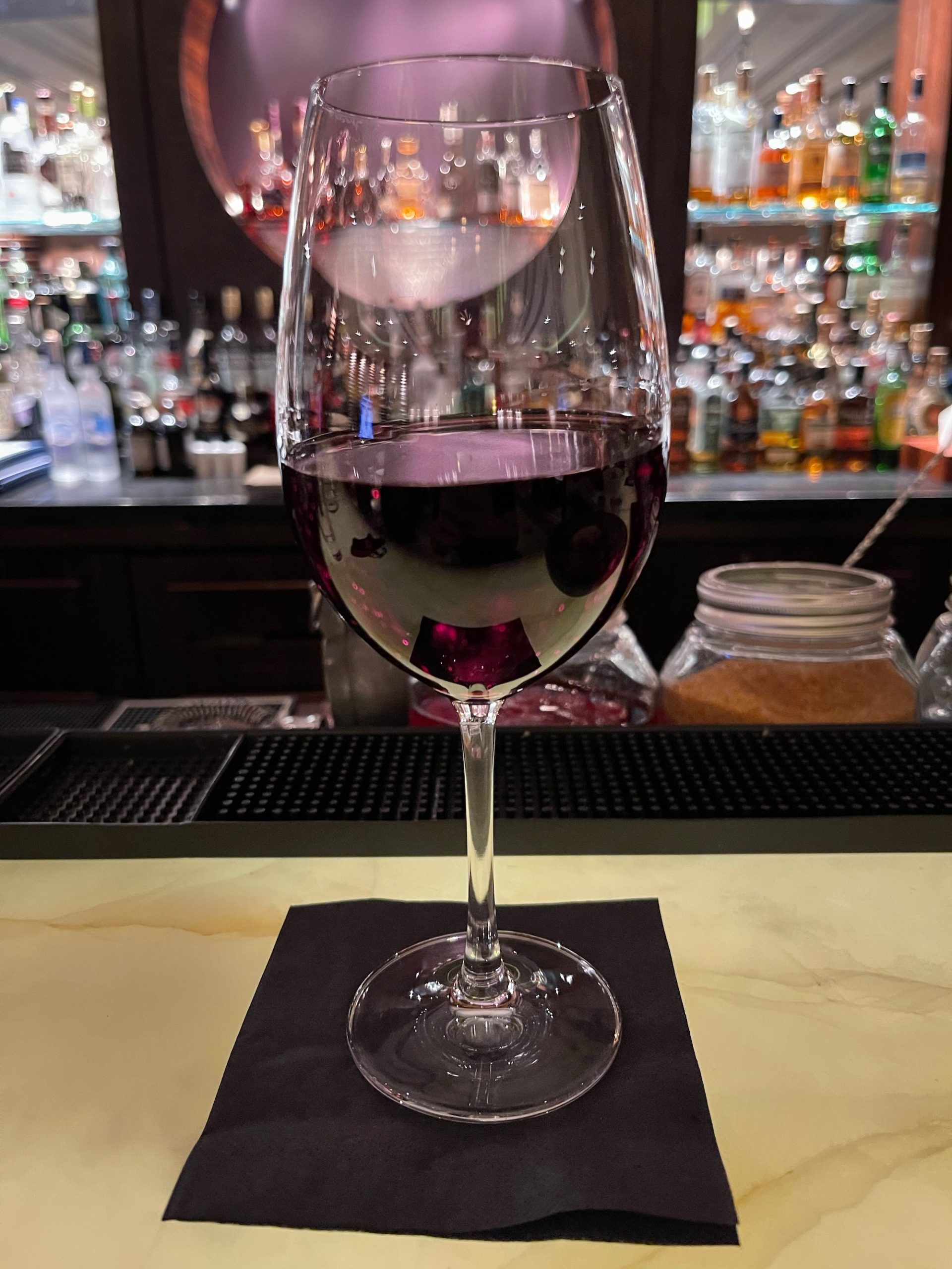 a glass of wine on a table