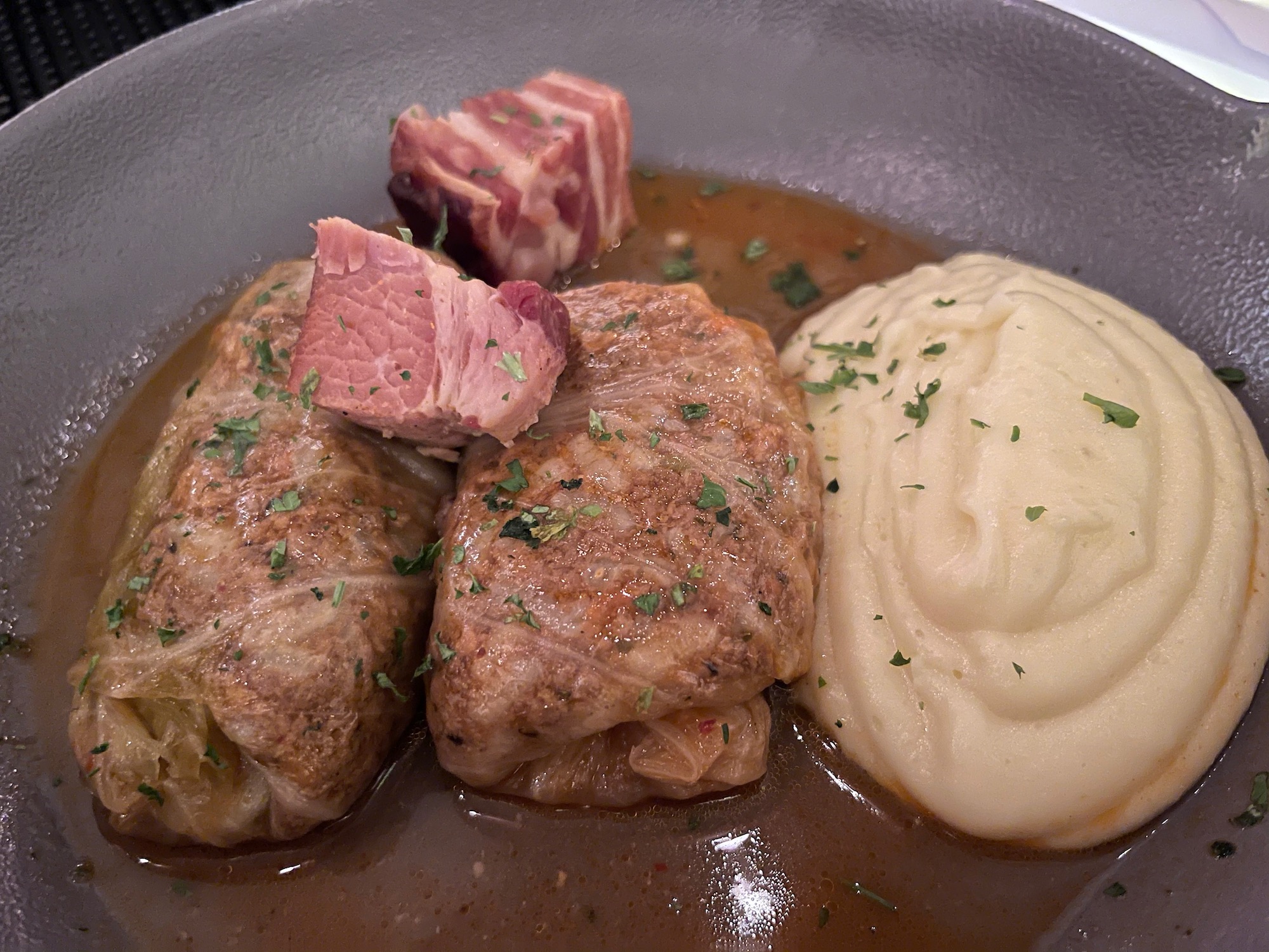 a plate of food with meat and mashed potatoes