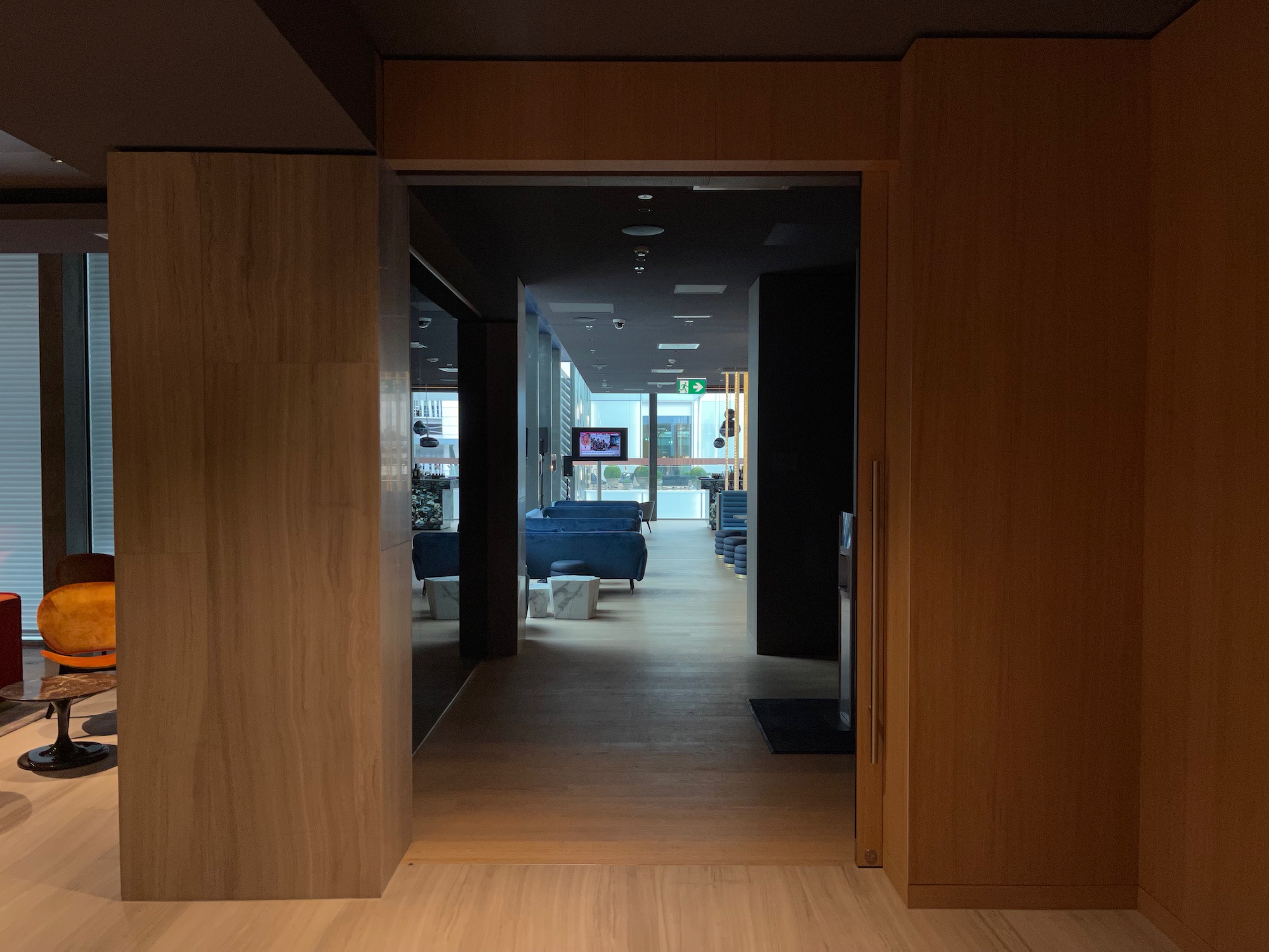 a hallway with a wood floor and a wood floor and a wood floor