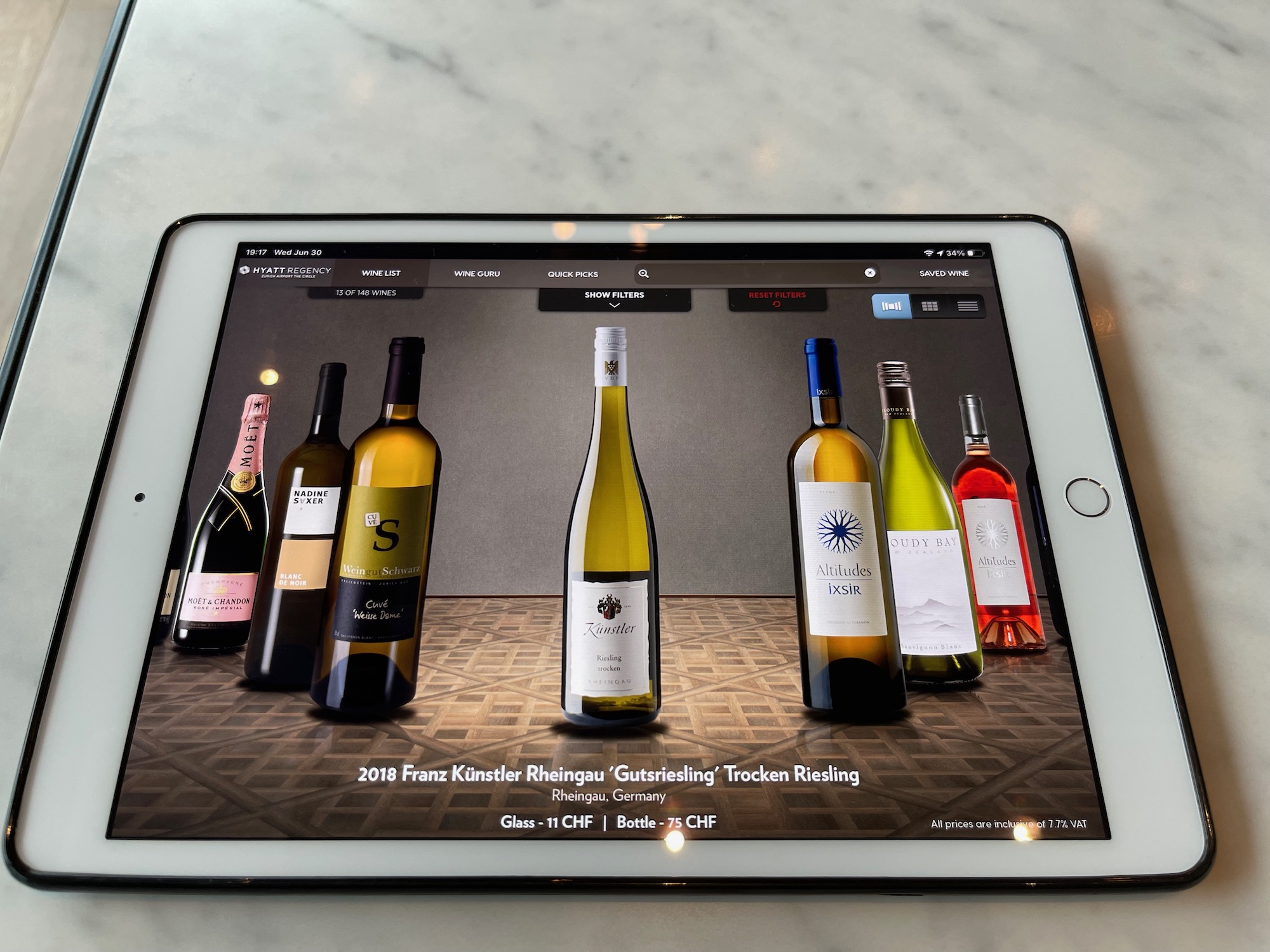 a tablet with a picture of wine bottles on it