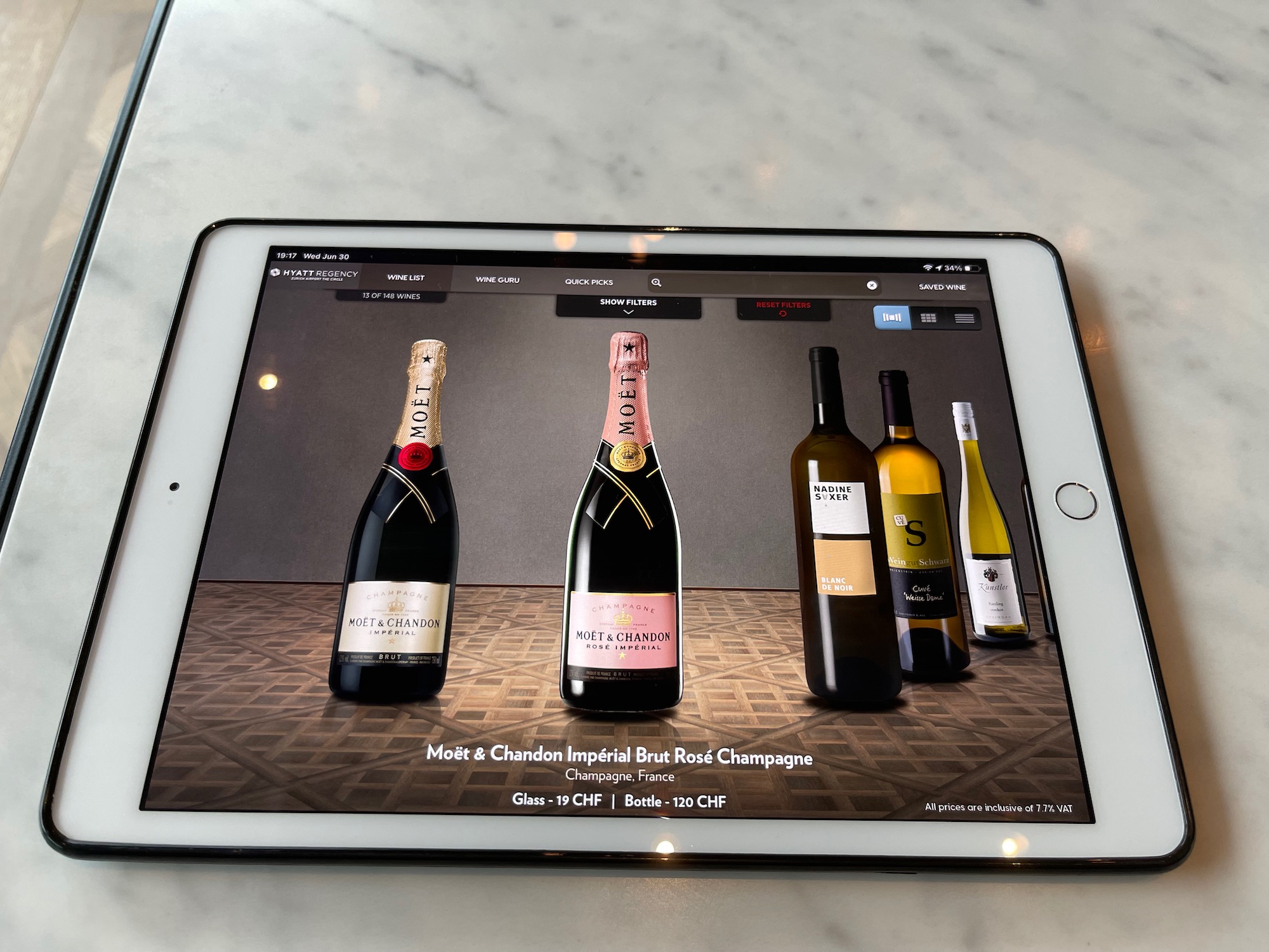 a tablet with a picture of wine bottles on it