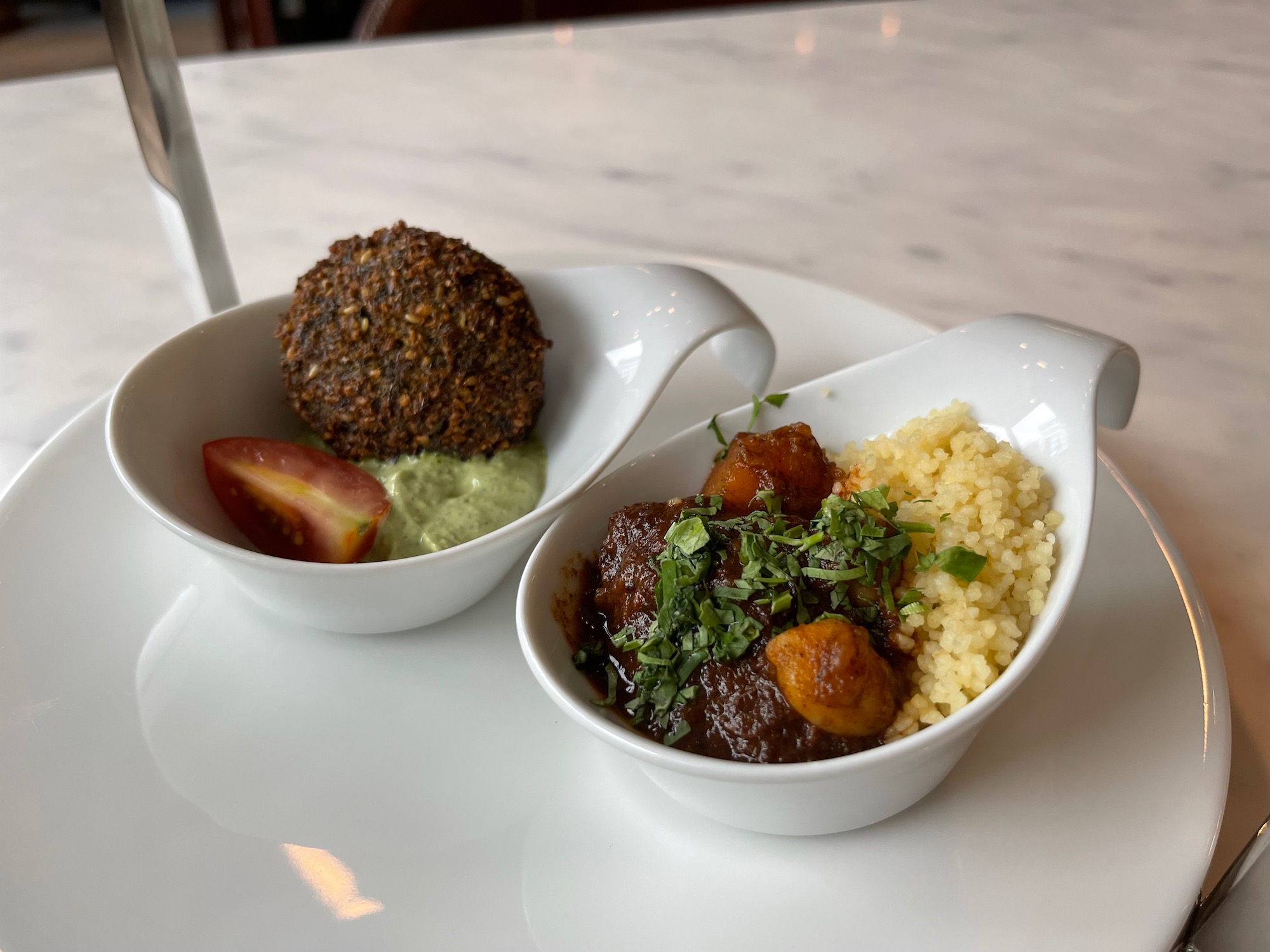 a bowl of food on a white plate