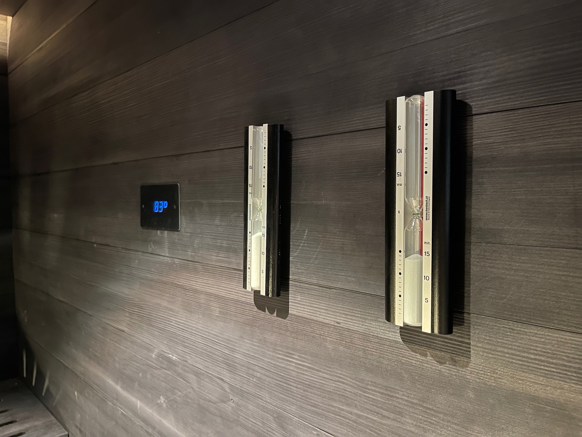 a wall with a thermometer and a thermostat