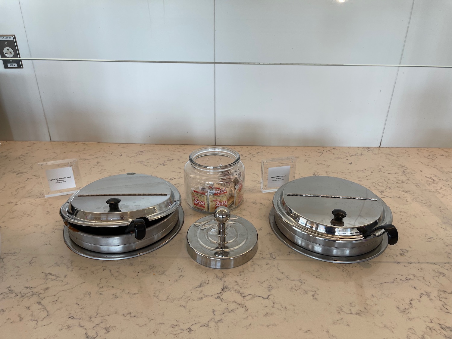 a group of metal containers on a counter