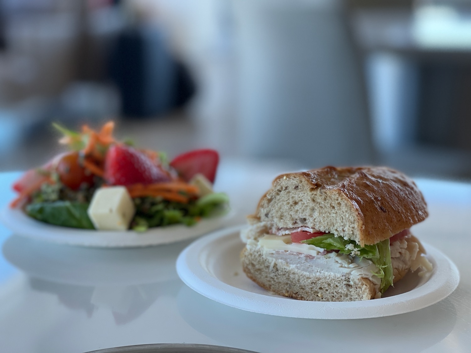 a sandwich and salad on plates