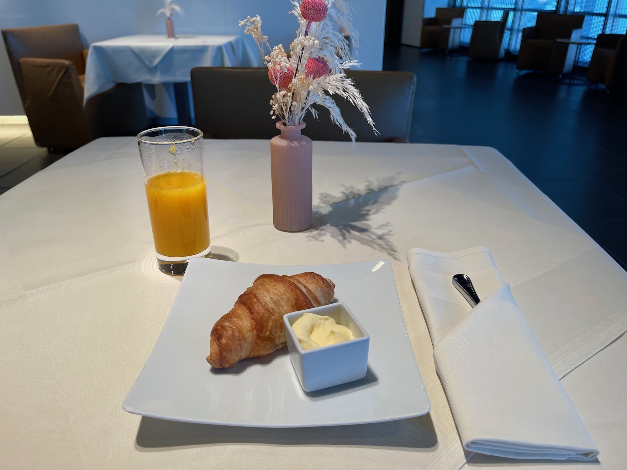a plate of croissant and butter on a table
