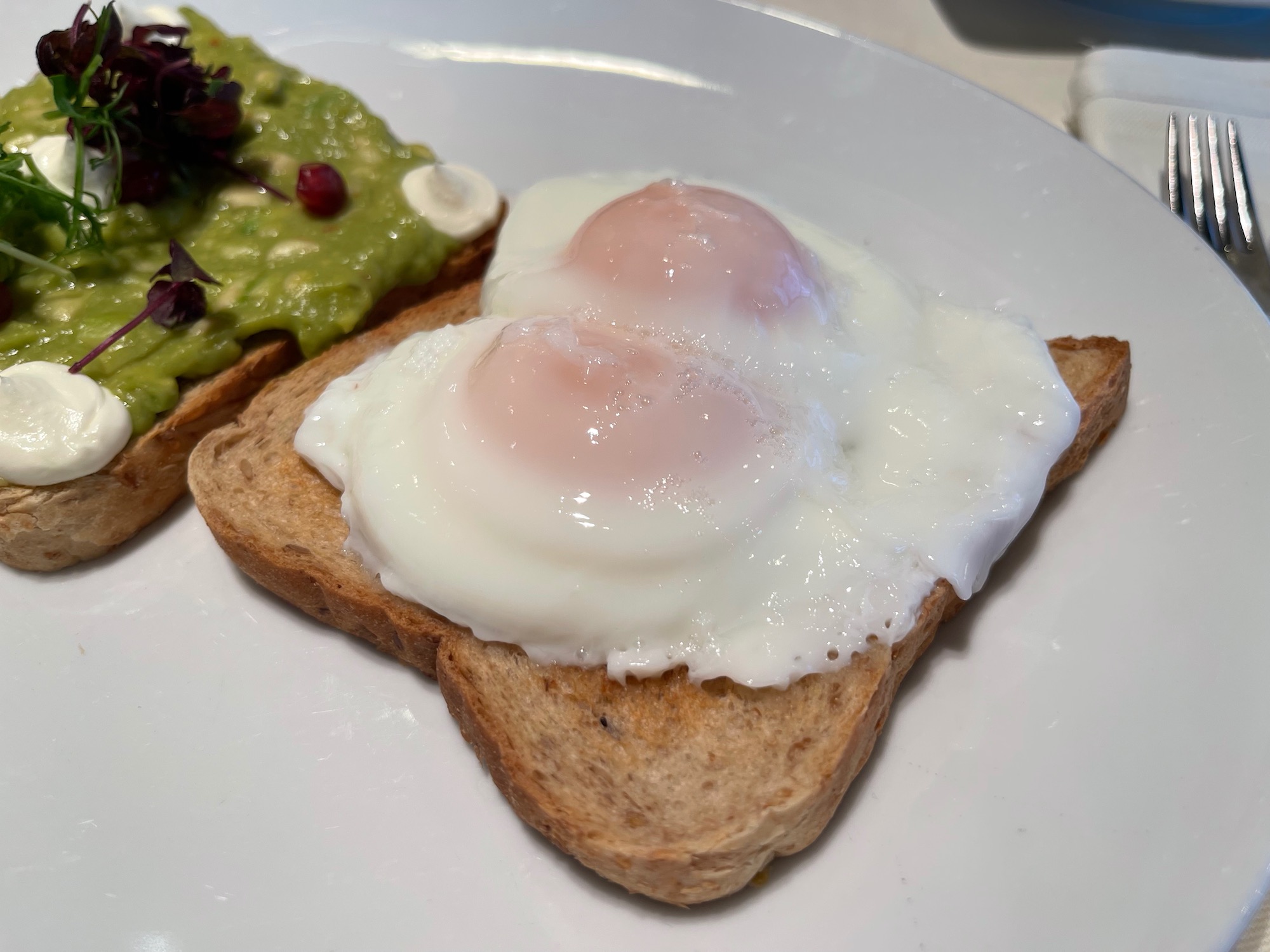 a plate of toast with eggs on top