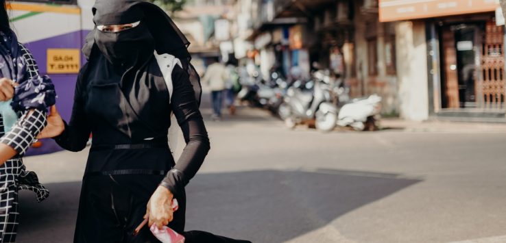 a woman wearing a black outfit