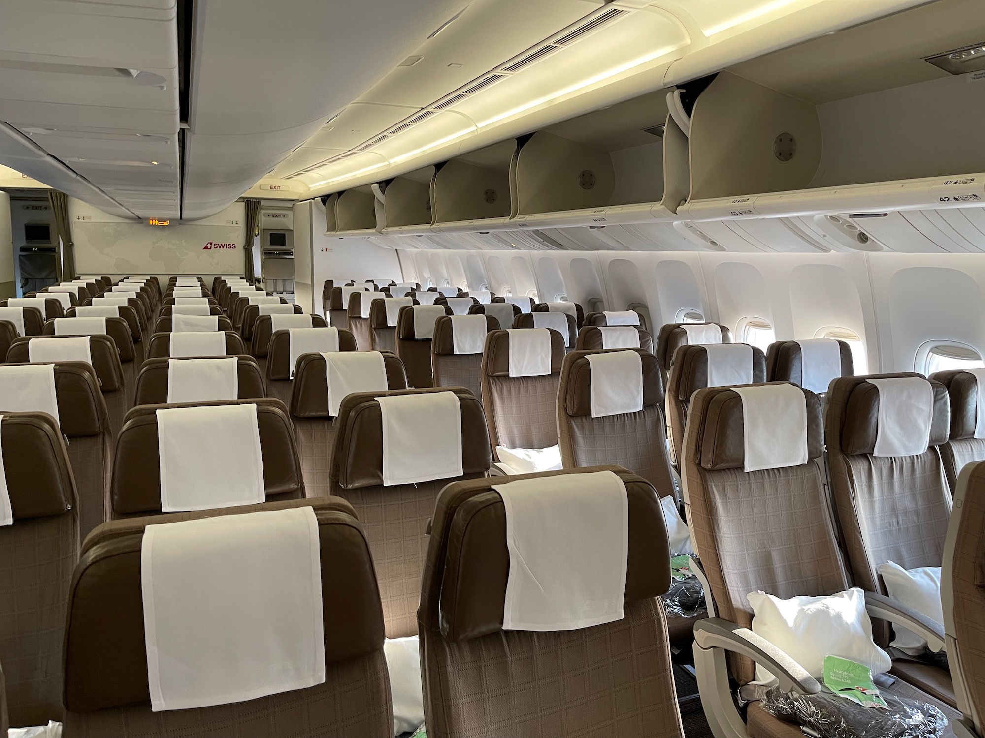 an airplane with seats and a white towel on it