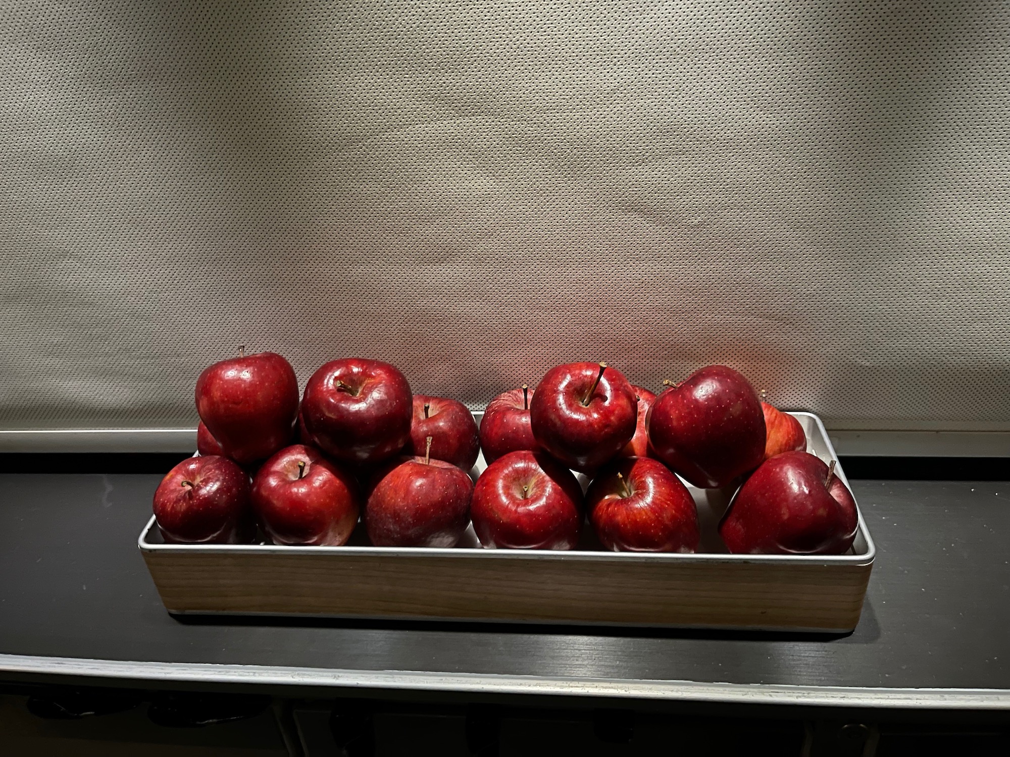 a tray of red apples