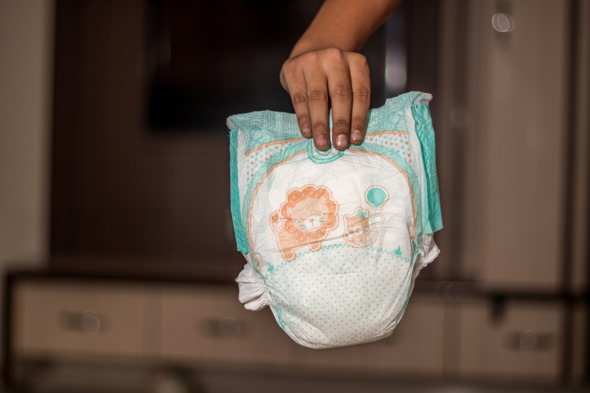 a person holding a diaper