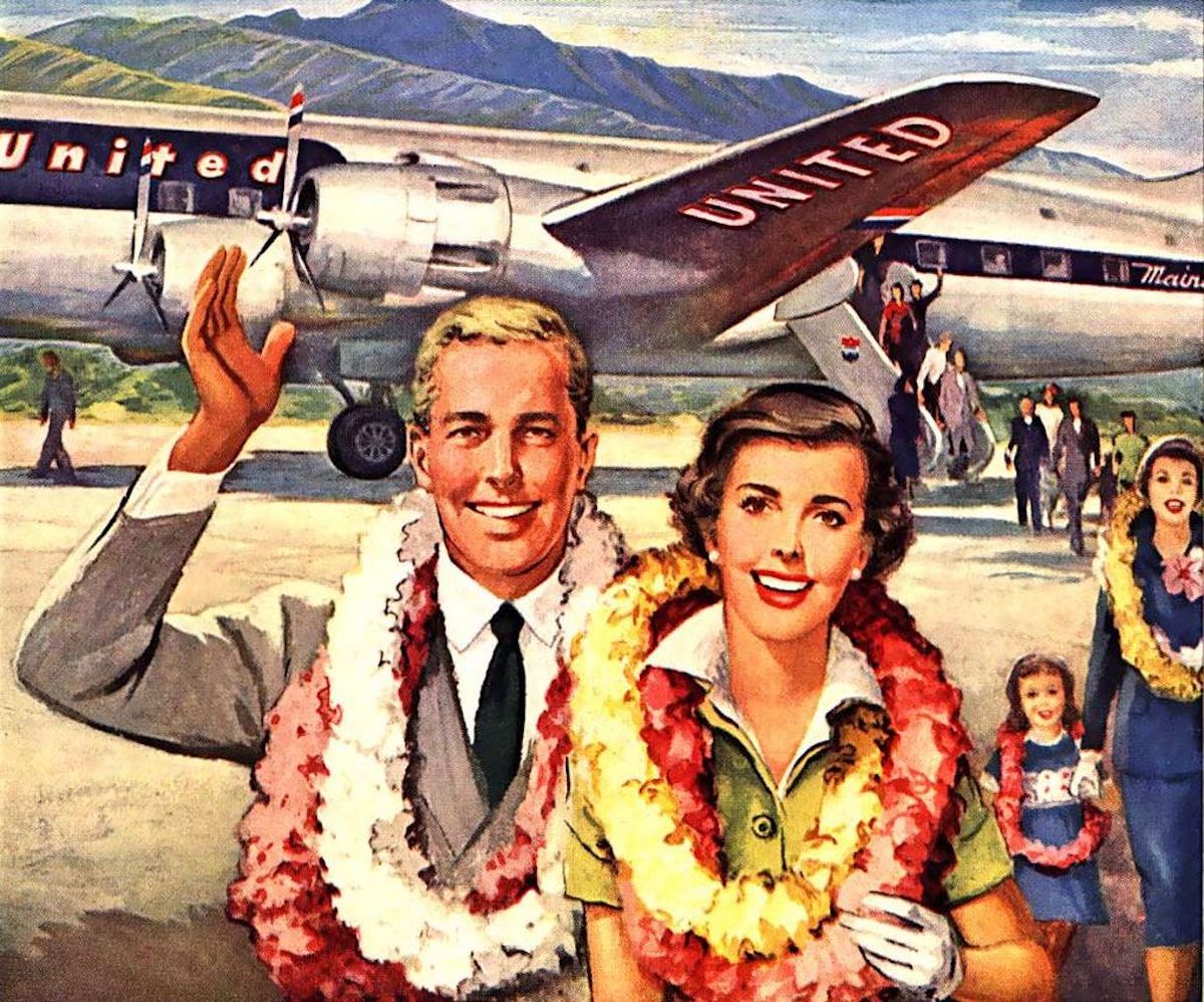 a man and woman in front of an airplane