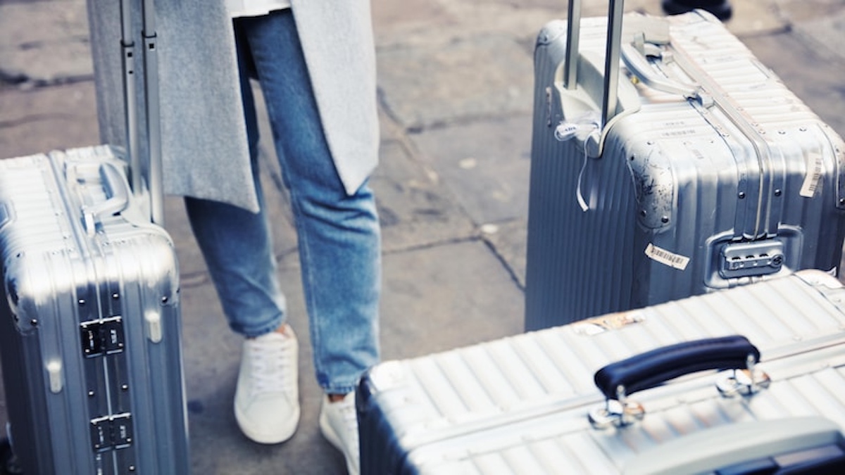 a person standing next to luggage