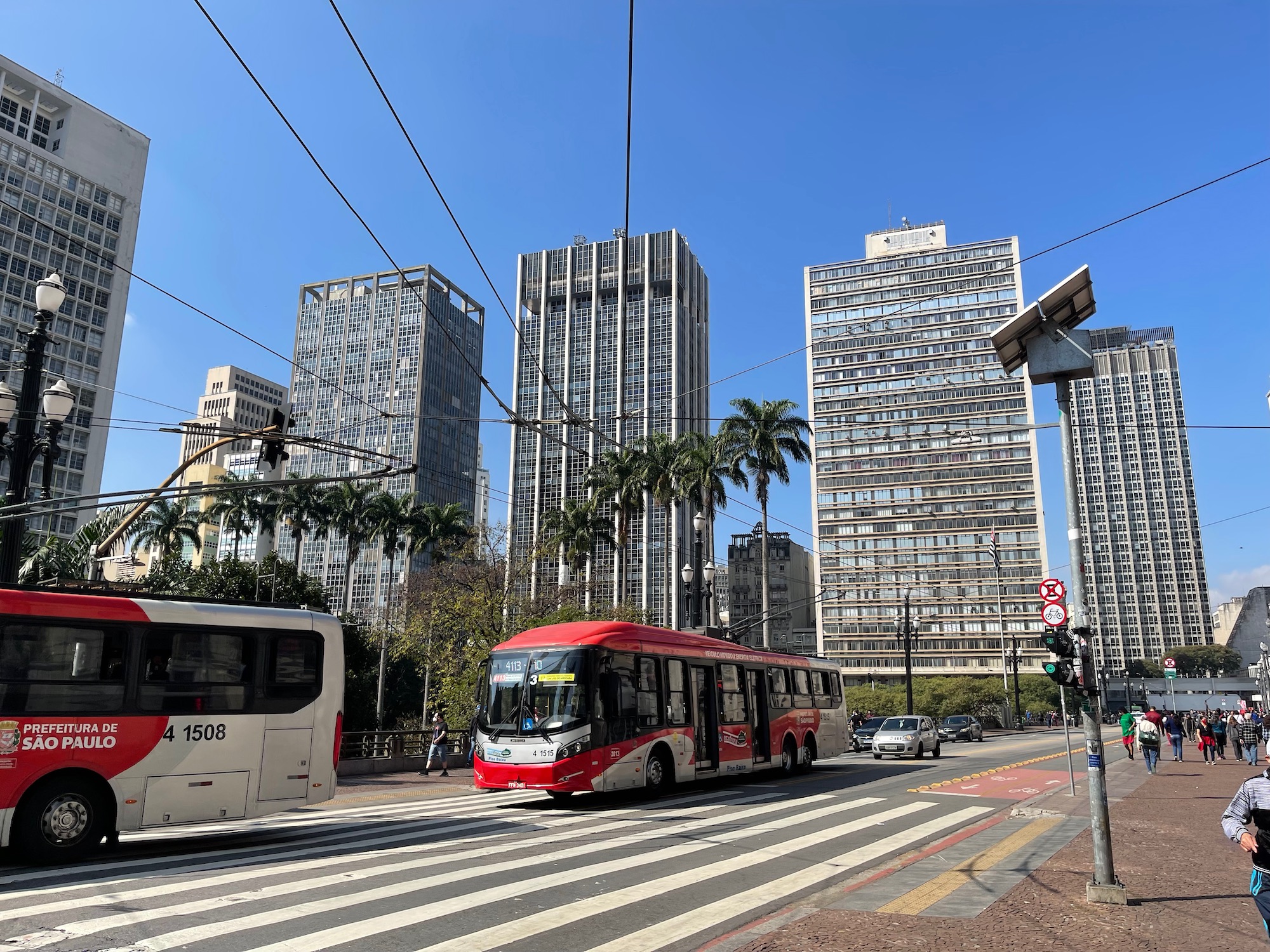 a bus on a street with buildings in the background