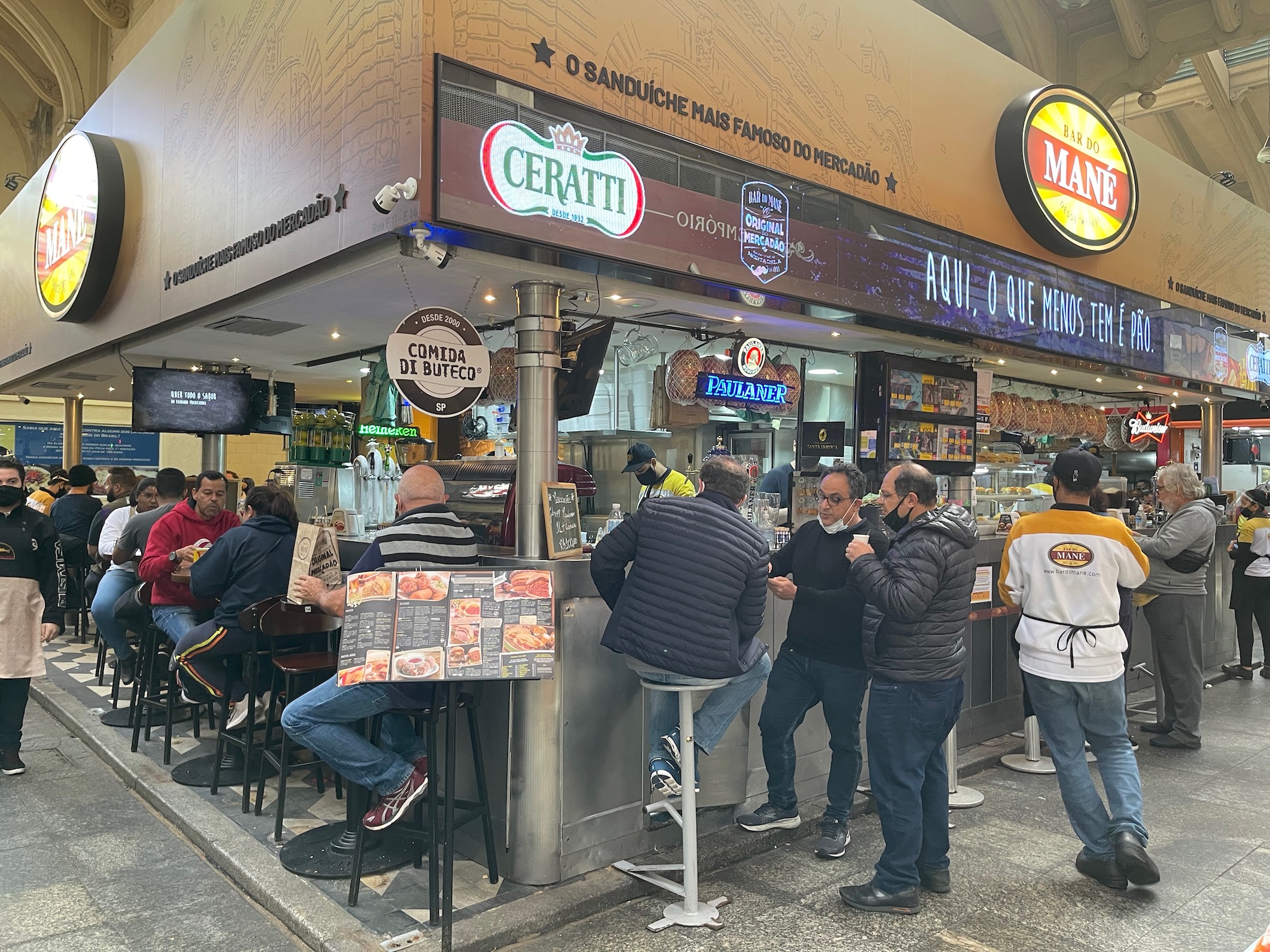 a group of people outside a restaurant