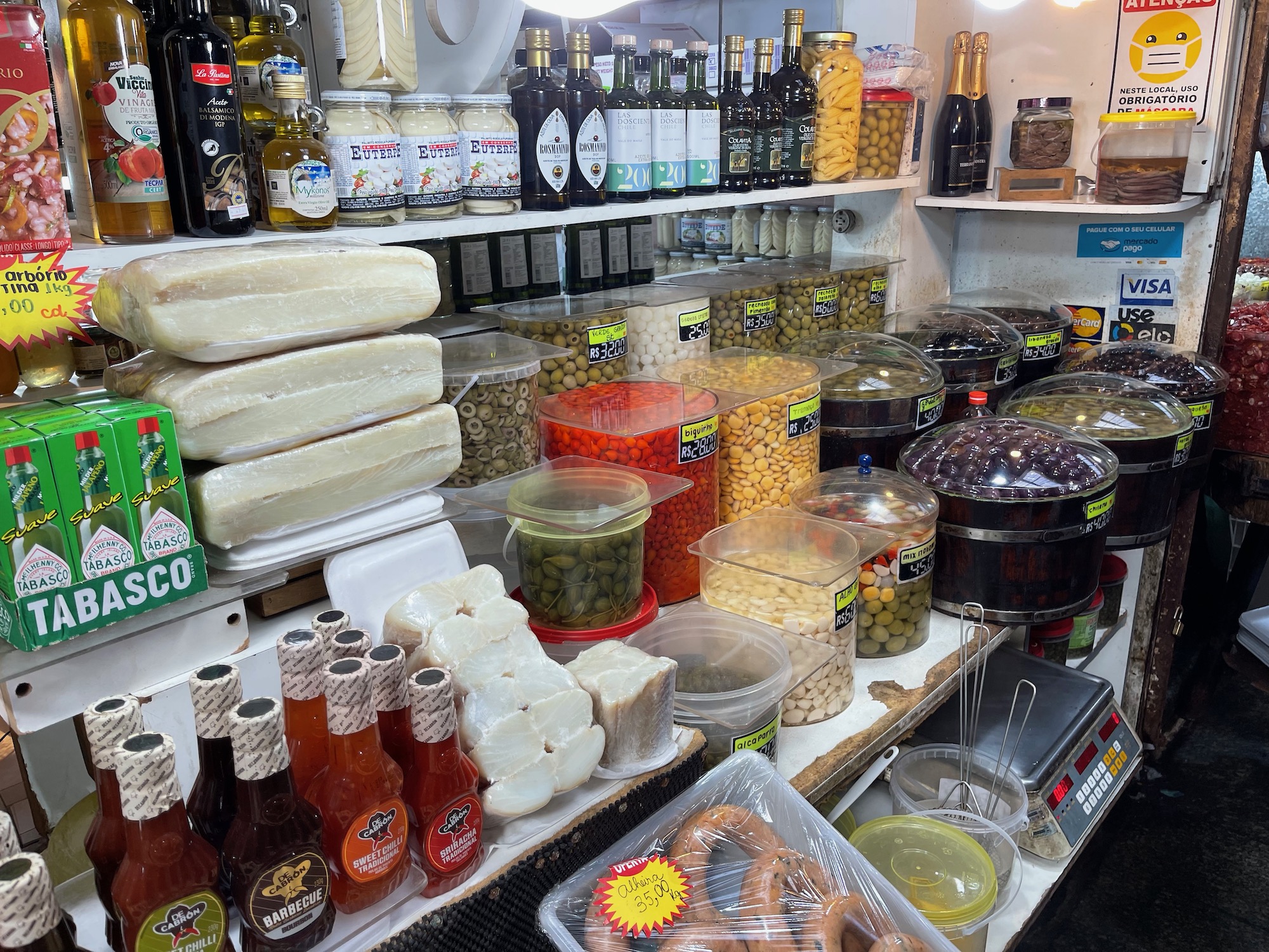 a shelf with food and bottles on it