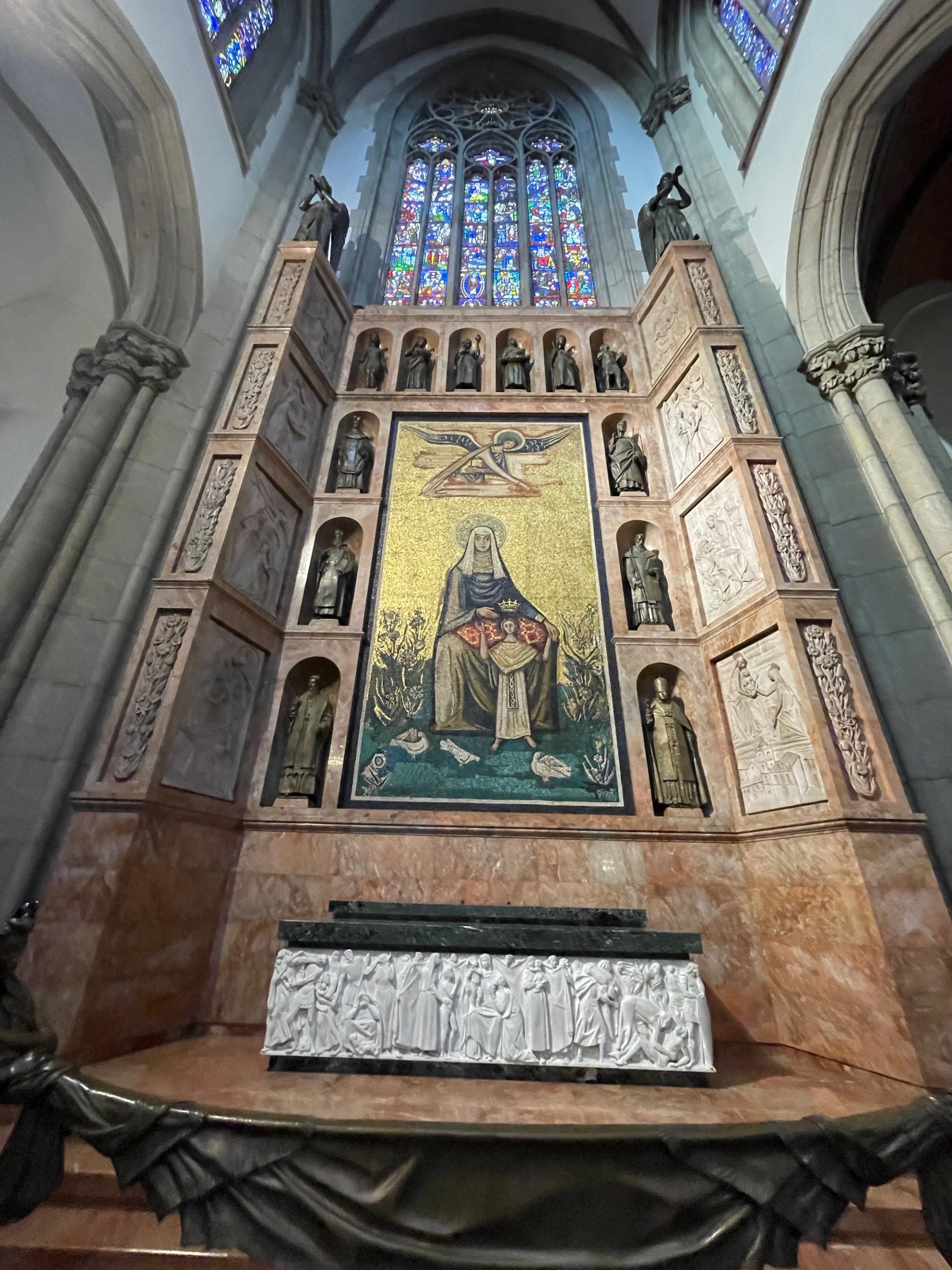 a religious shrine with a stained glass window