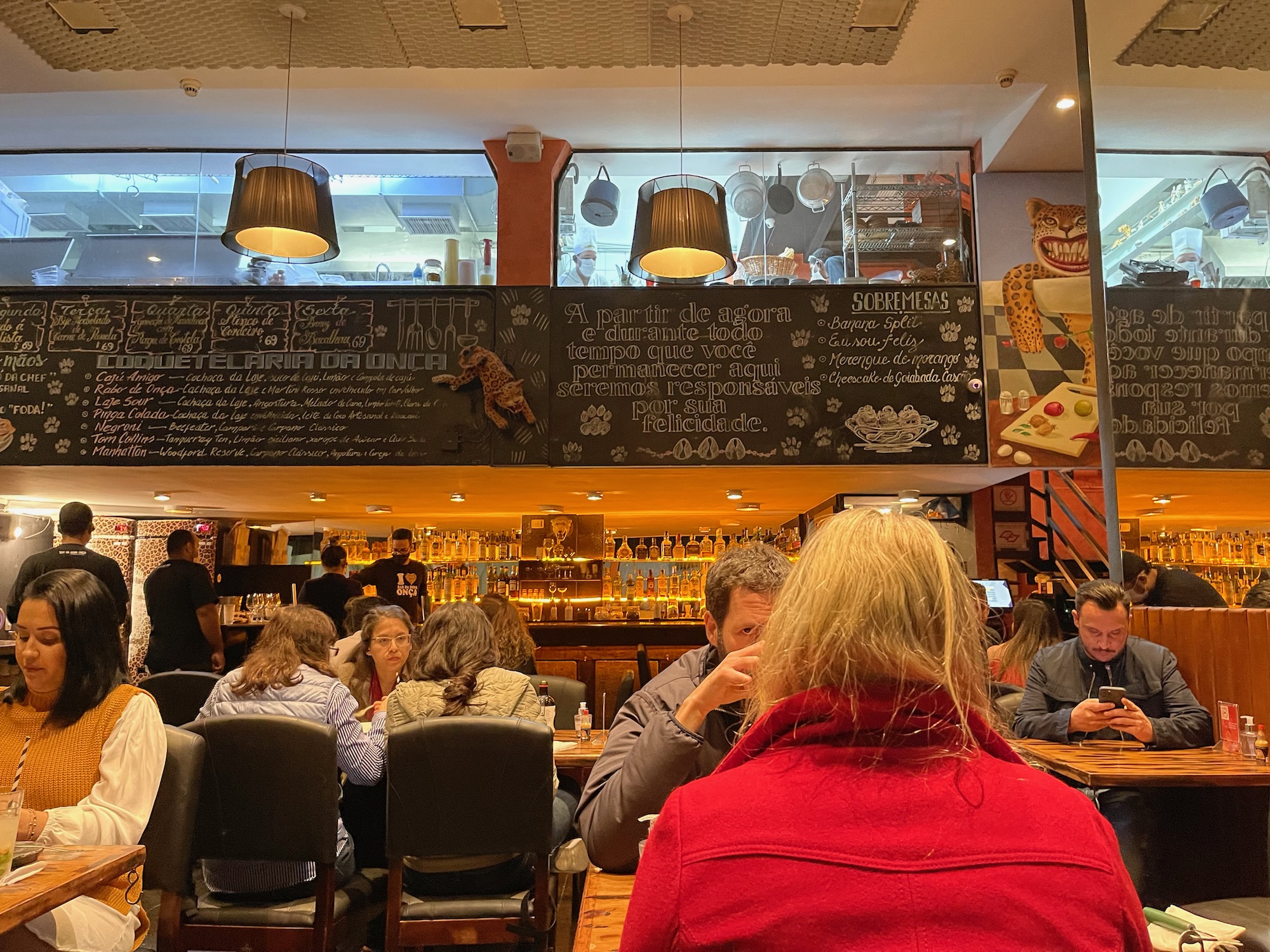 a group of people sitting at a table in a restaurant