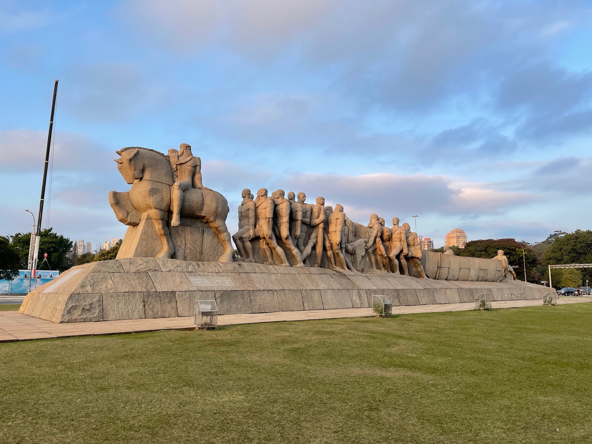 a large stone statue of people on horses