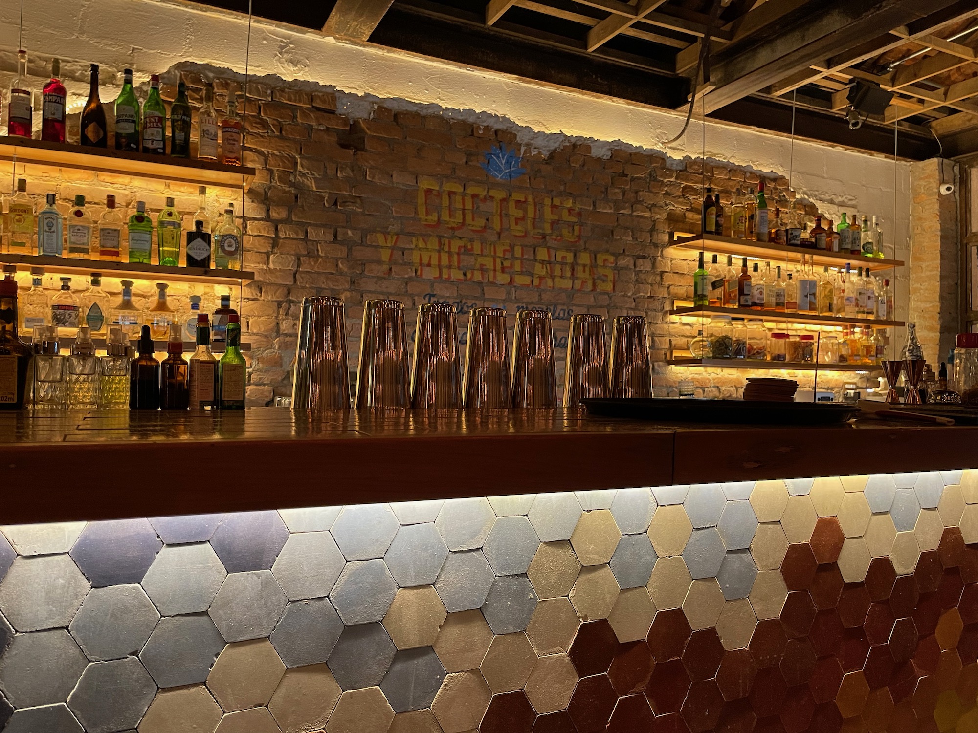 a bar with bottles on shelves