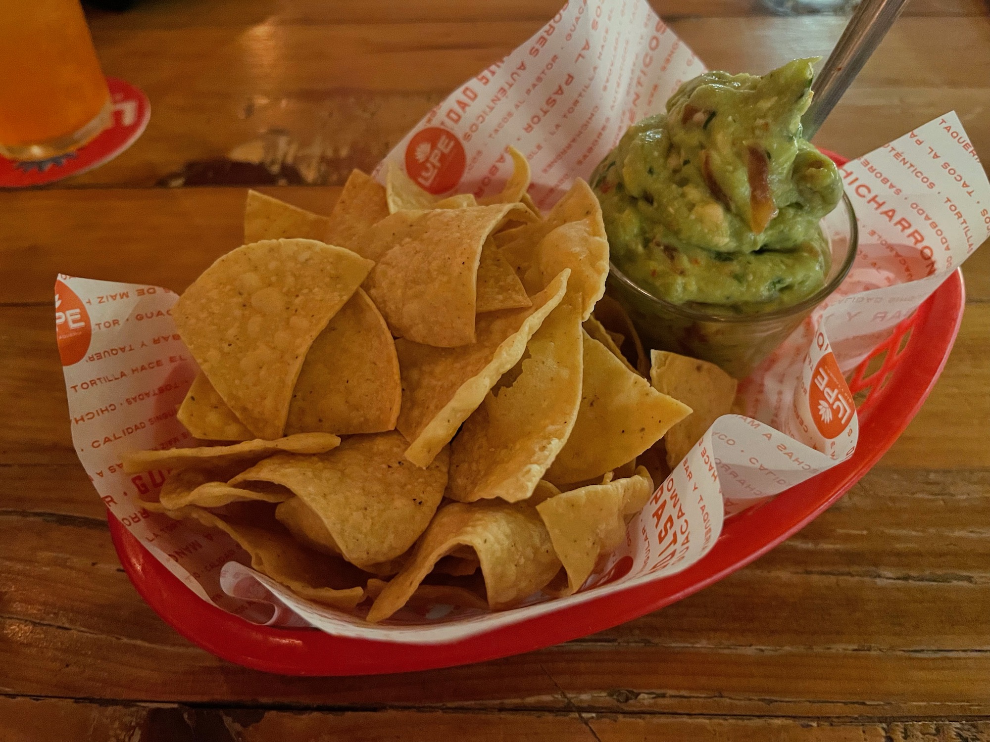 a bowl of chips and guacamole