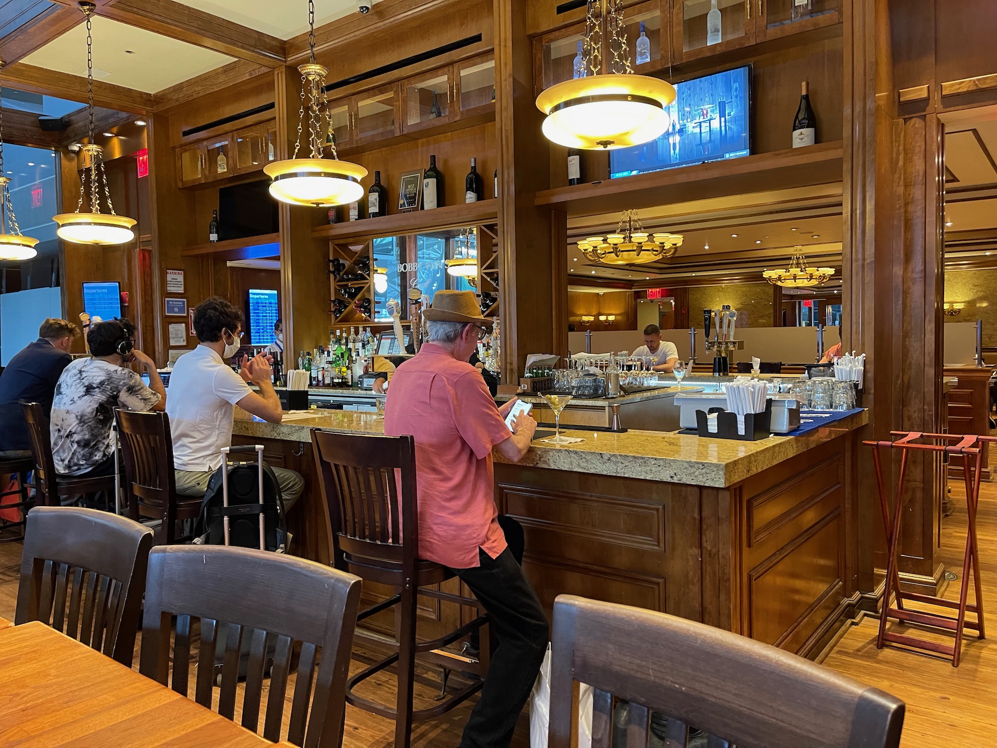 a group of people sitting at a bar