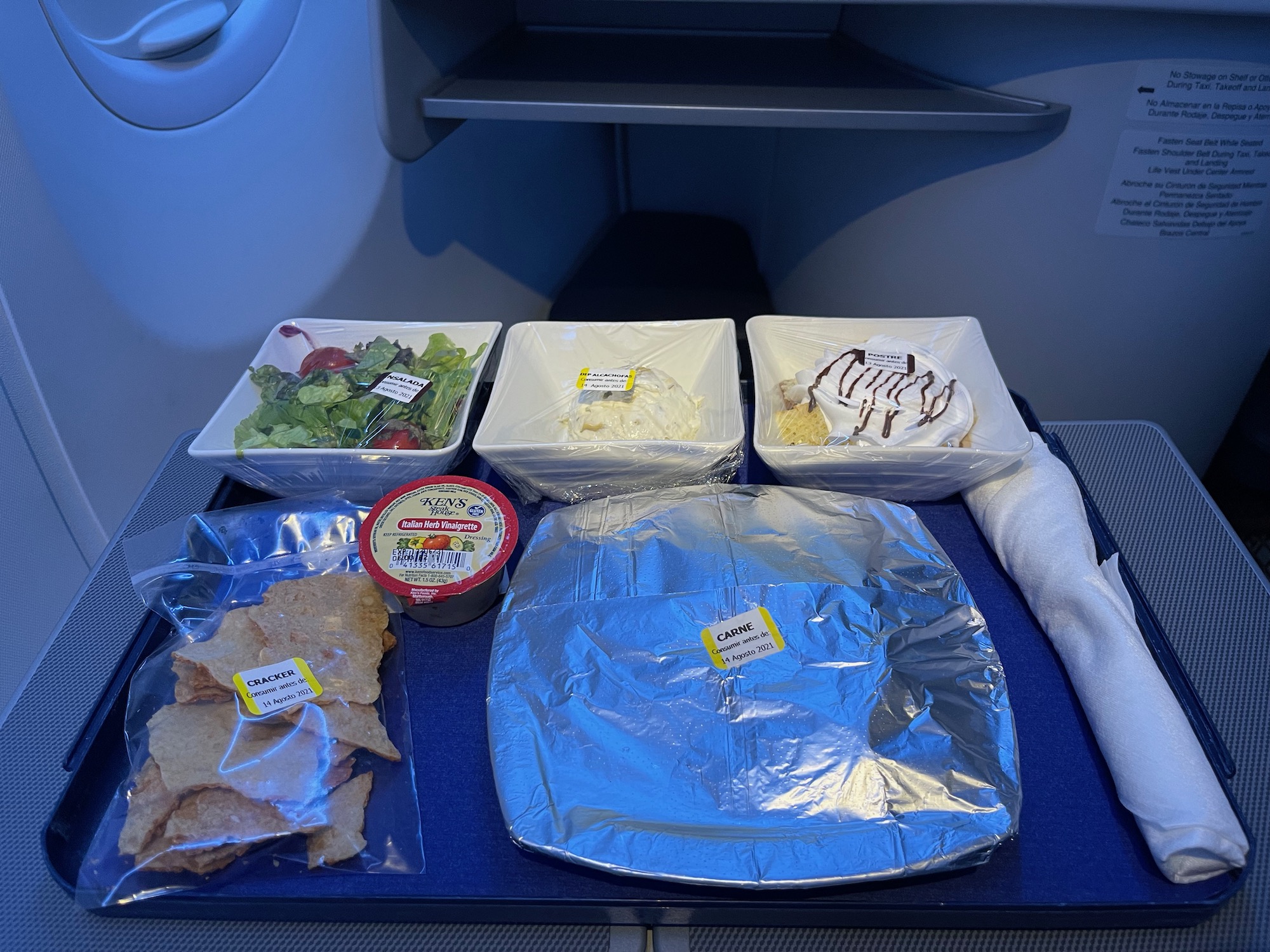 food on a tray on a plane