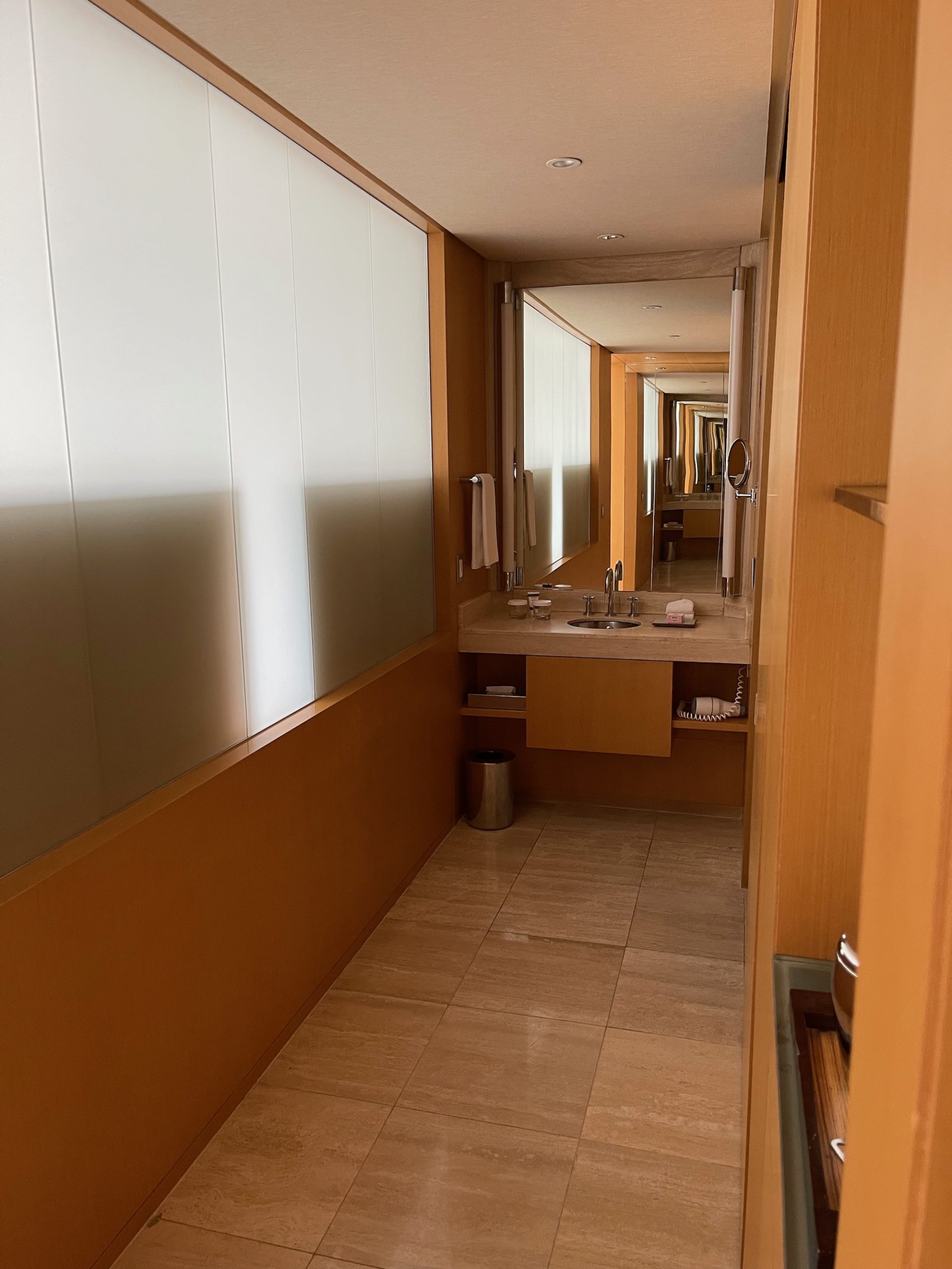 a bathroom with a mirror and sink