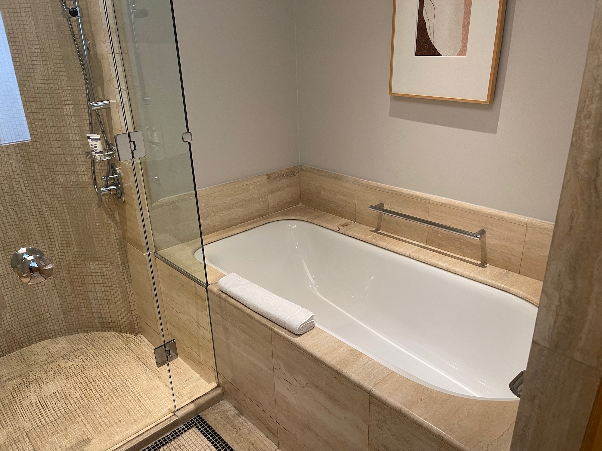 a bathroom with a glass shower door