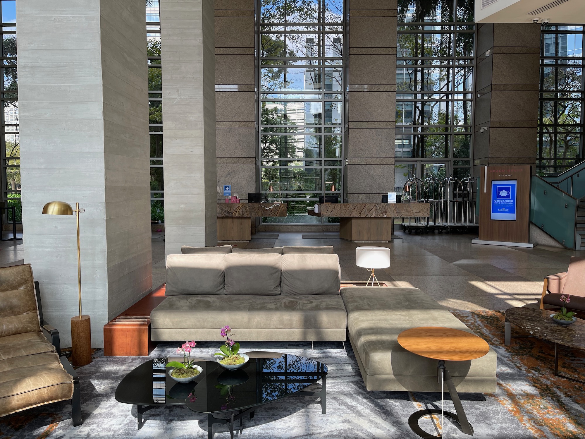 a large lobby with a couch and coffee table