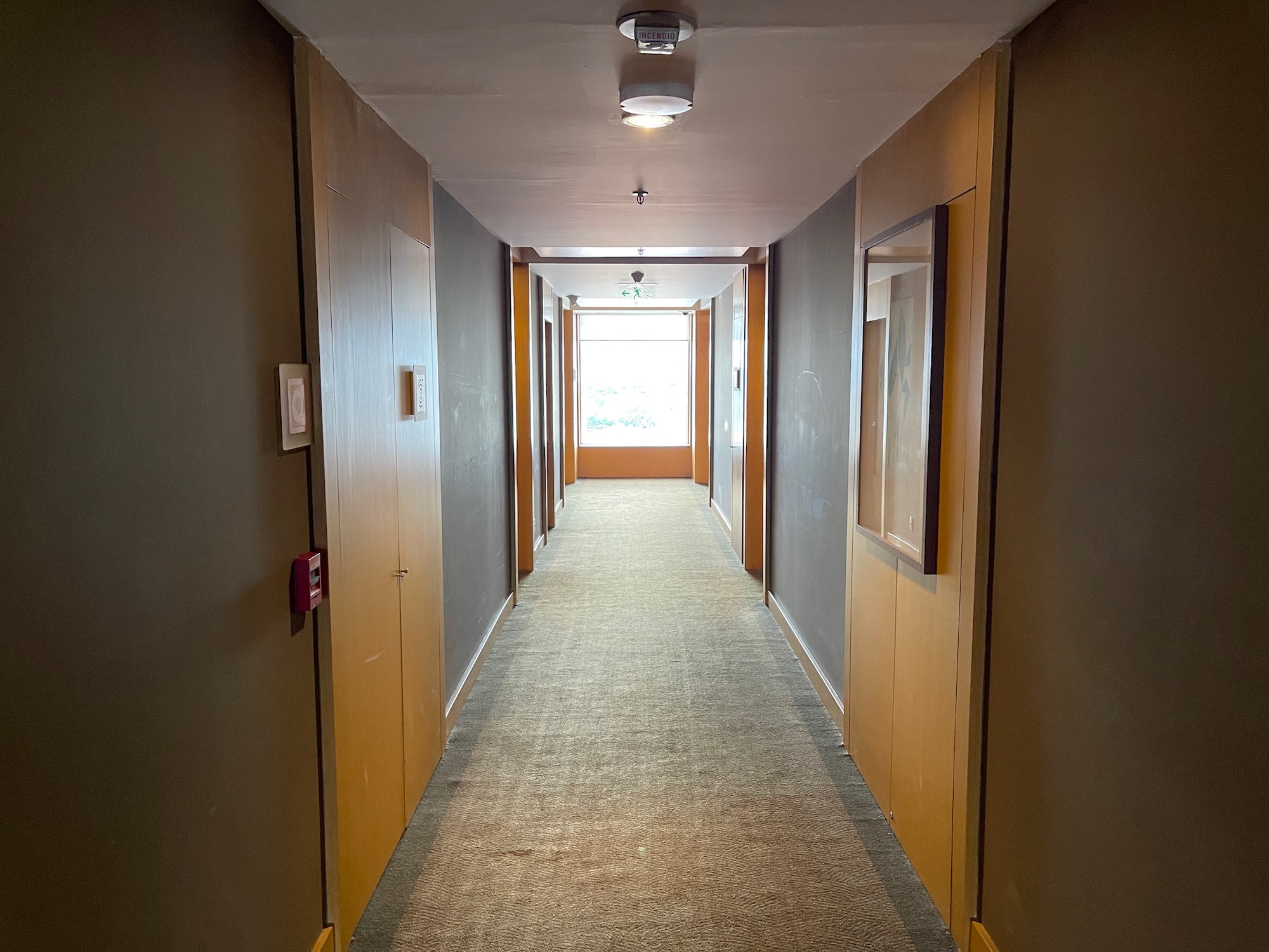 a hallway with a light on the wall