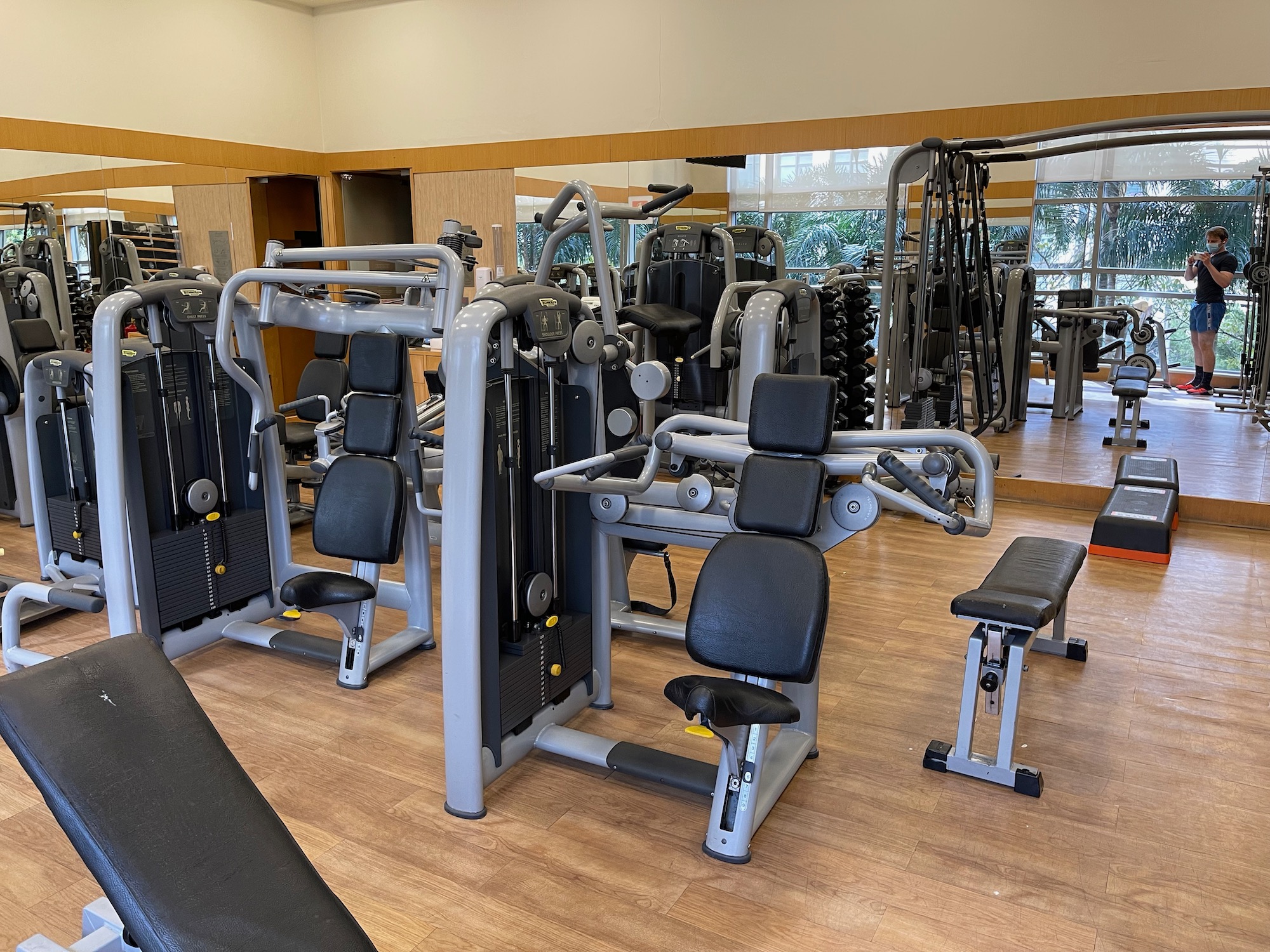 a gym with many exercise equipment