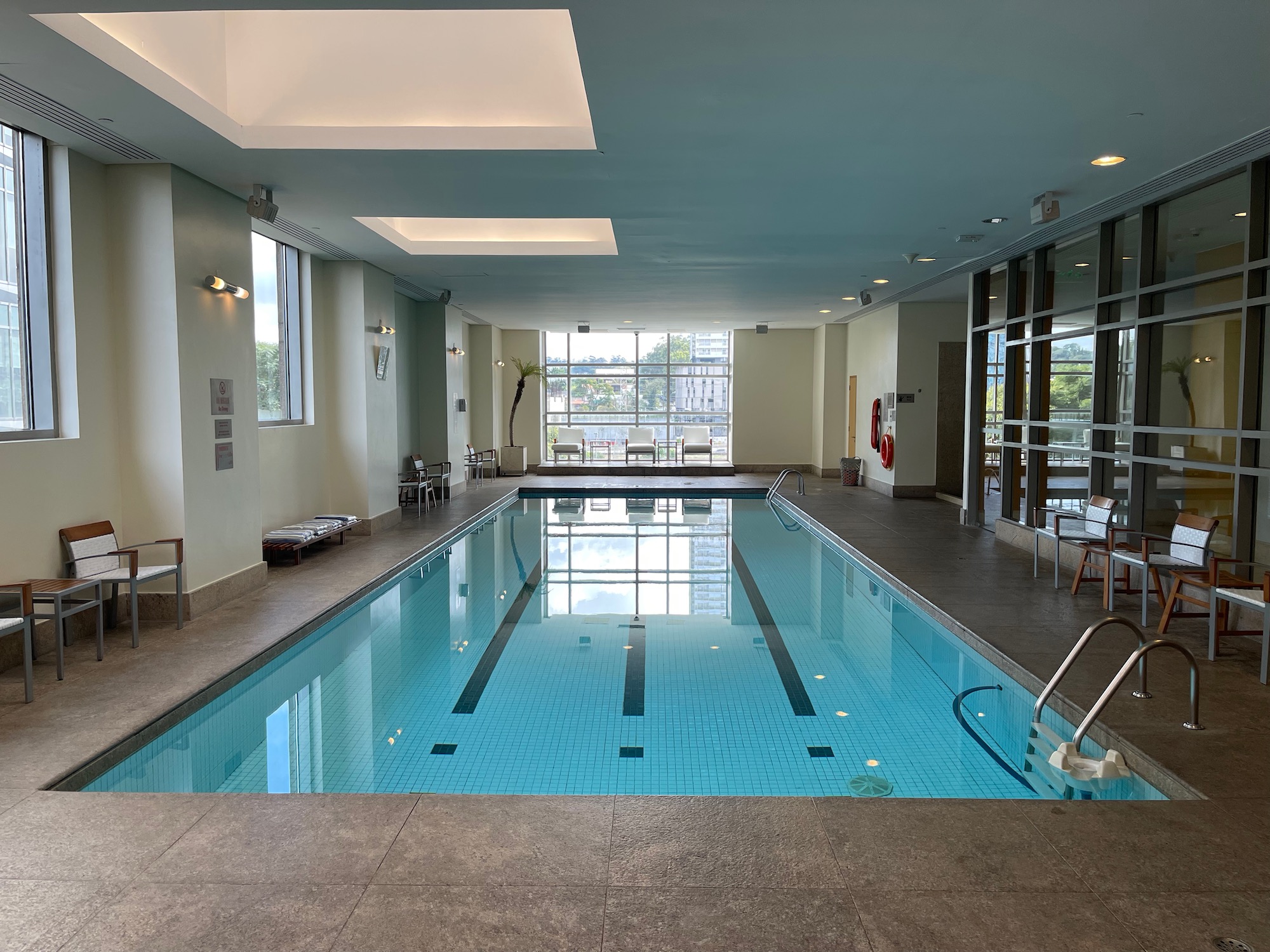 a indoor swimming pool with a large pool