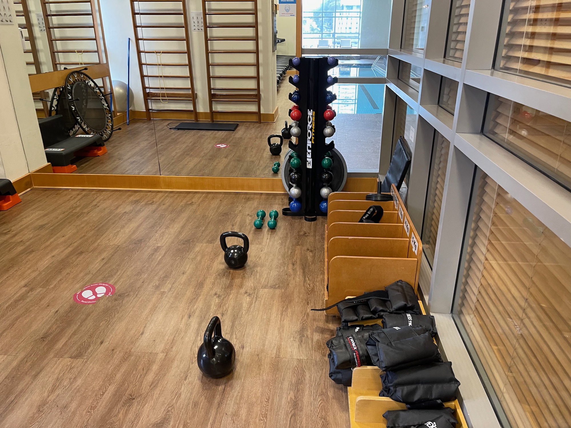 a gym with weights and kettlebells