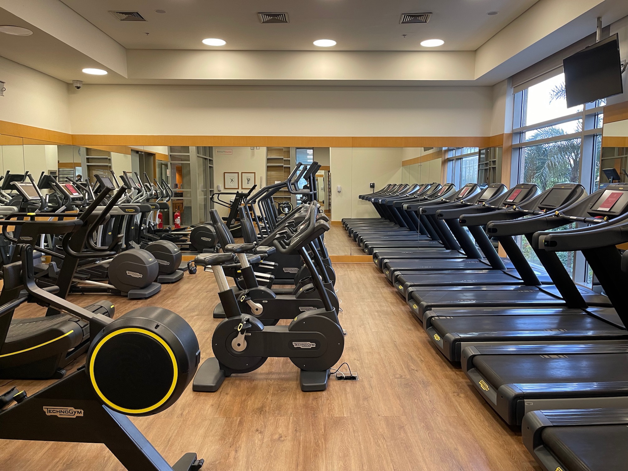a large room with treadmills and exercise machines