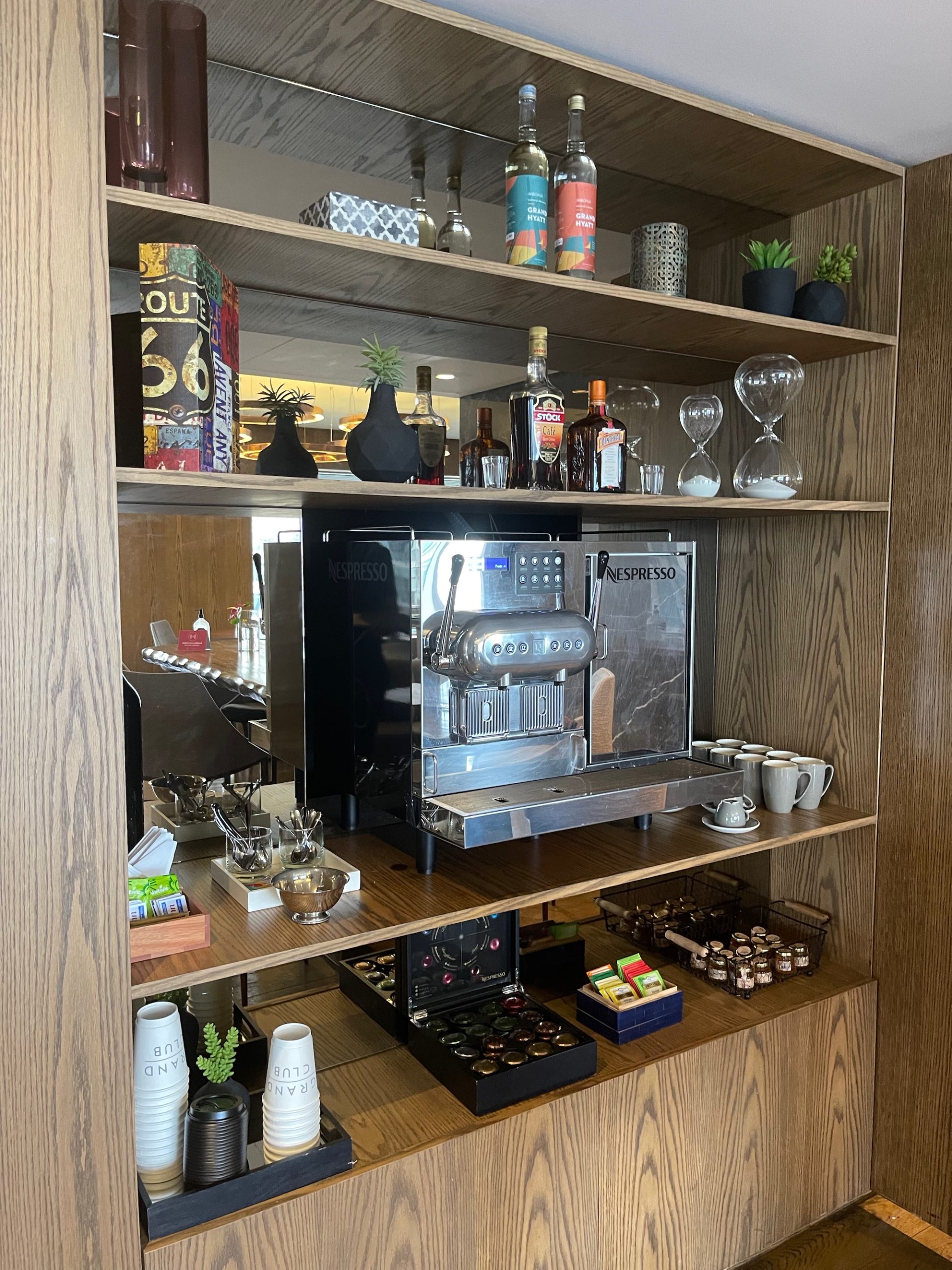 a shelf with a coffee machine and other objects on it