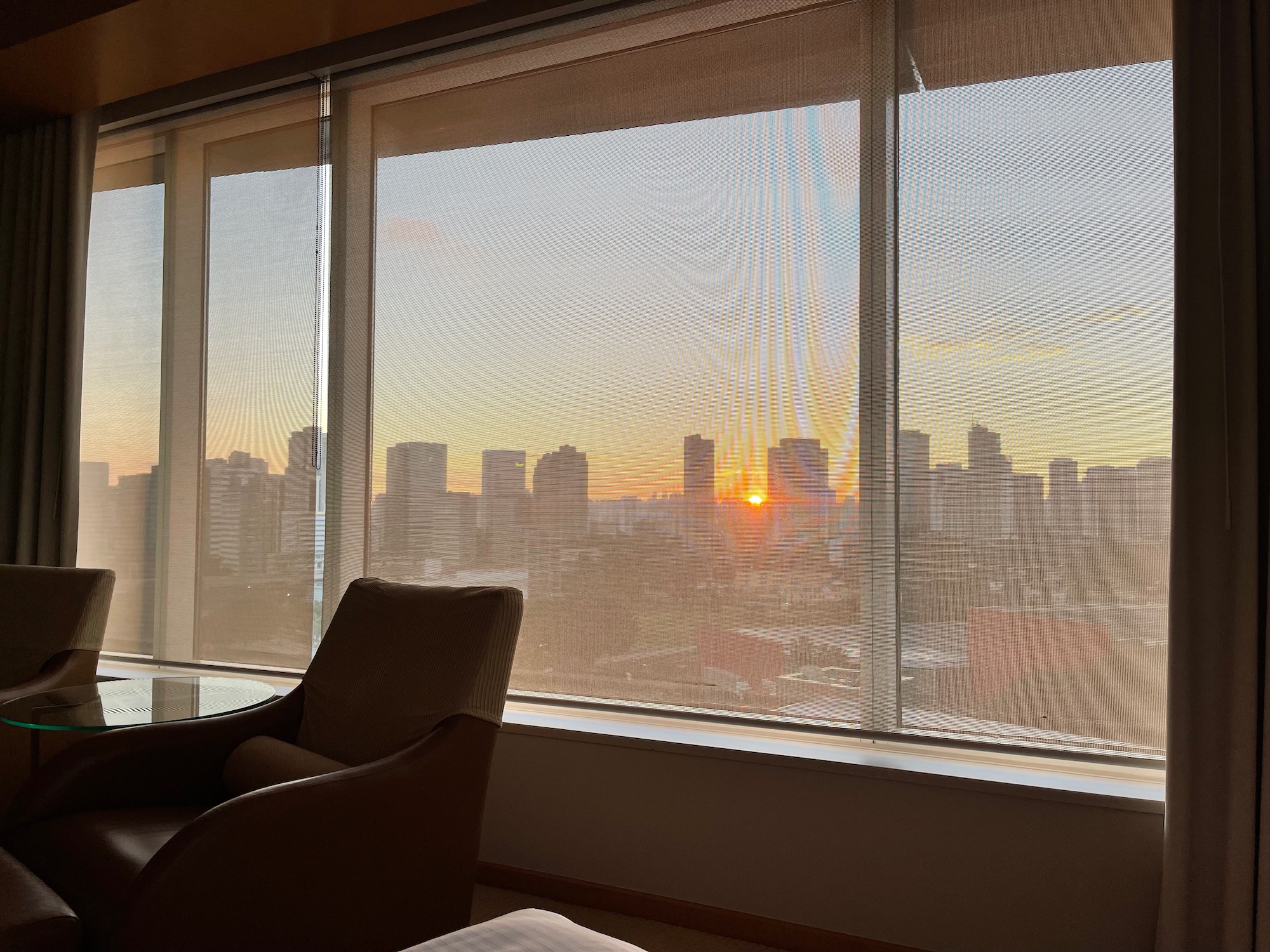 a room with a view of a city and a window