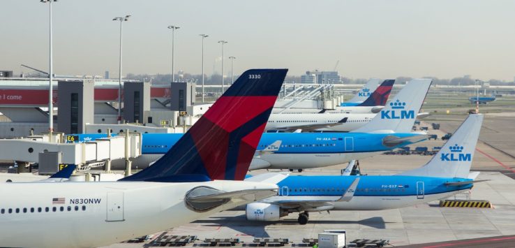 a group of airplanes at an airport