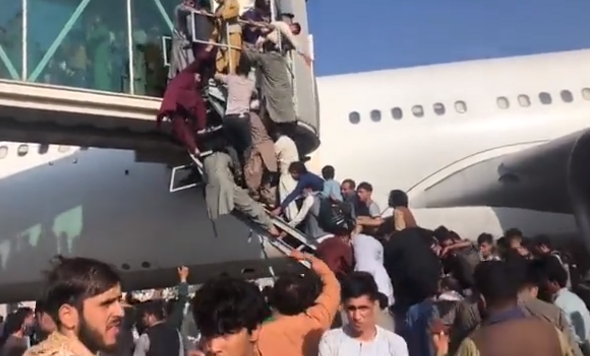 people climbing up a plane