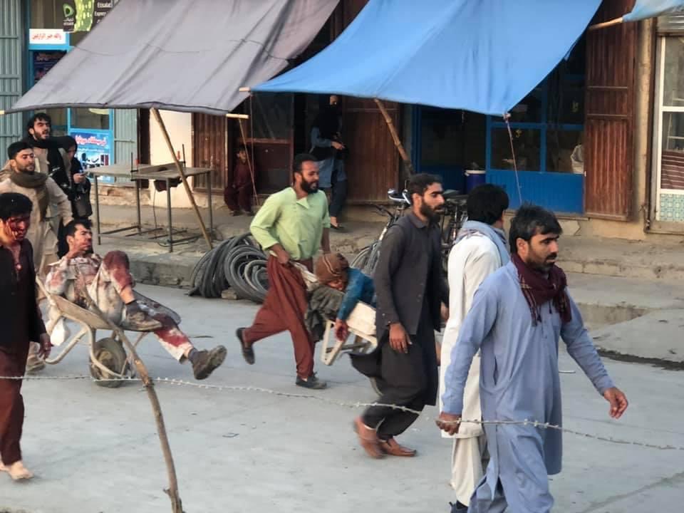 a group of people walking on a street